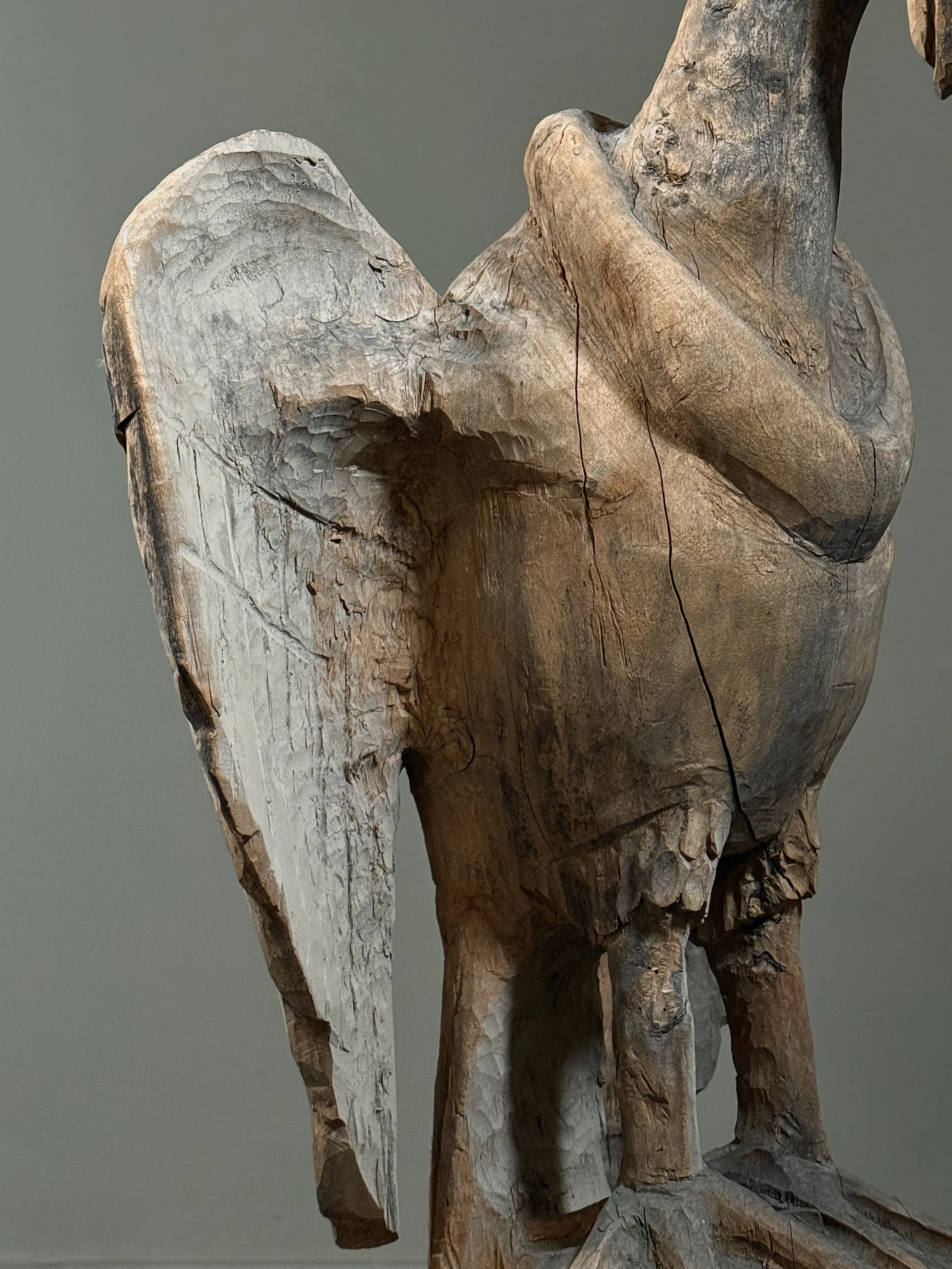 Monumental folk art bird carving wing detail