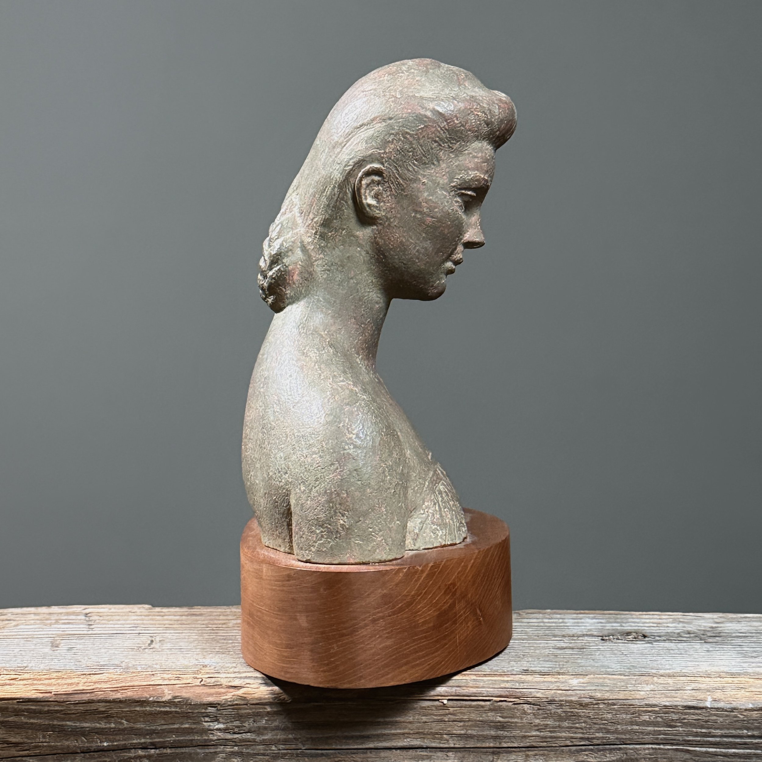 Side profile highlighting sculptural volume and modeling