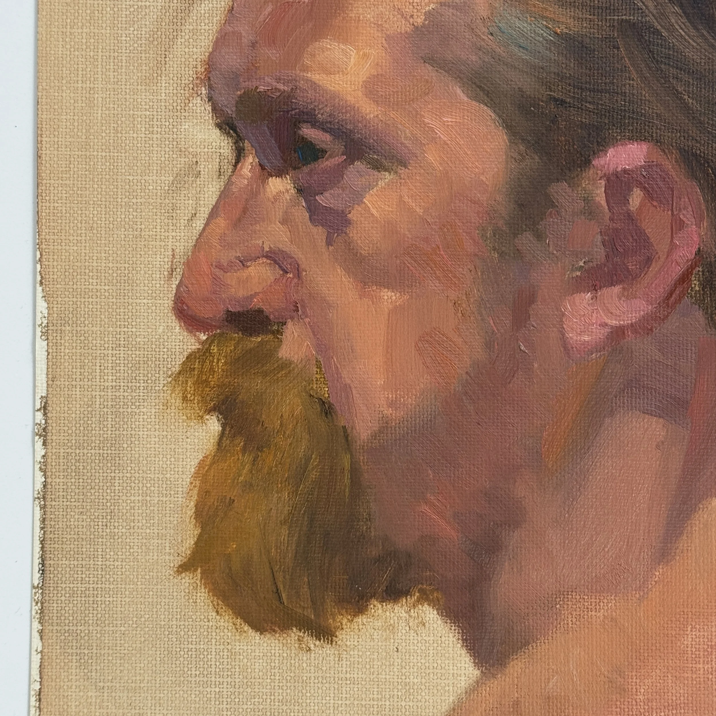 Unframed 1970s realist portrait of a man with beard, oil on canvas paper.