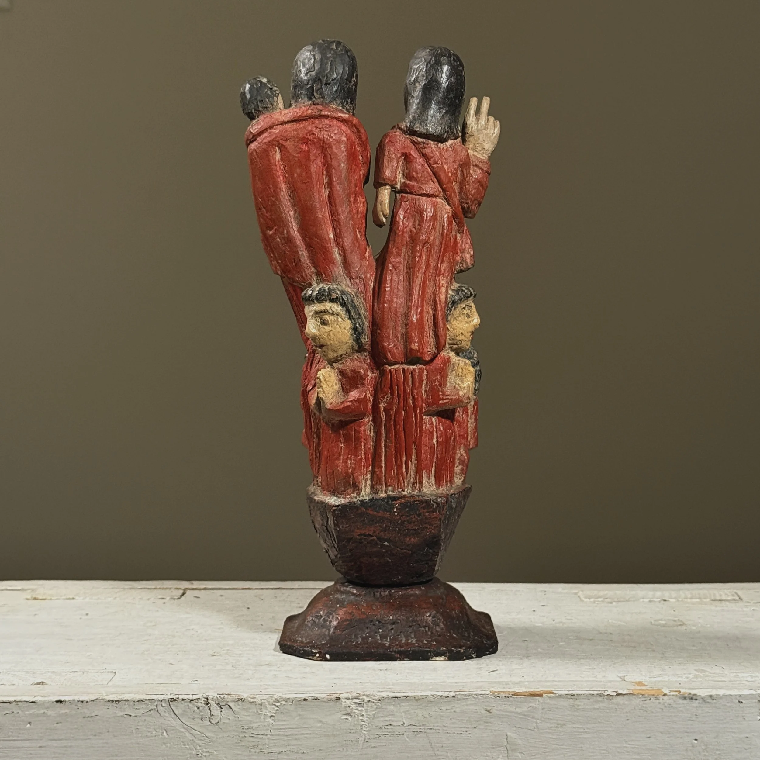 Rear view of hand carved polychrome devotional sculpture