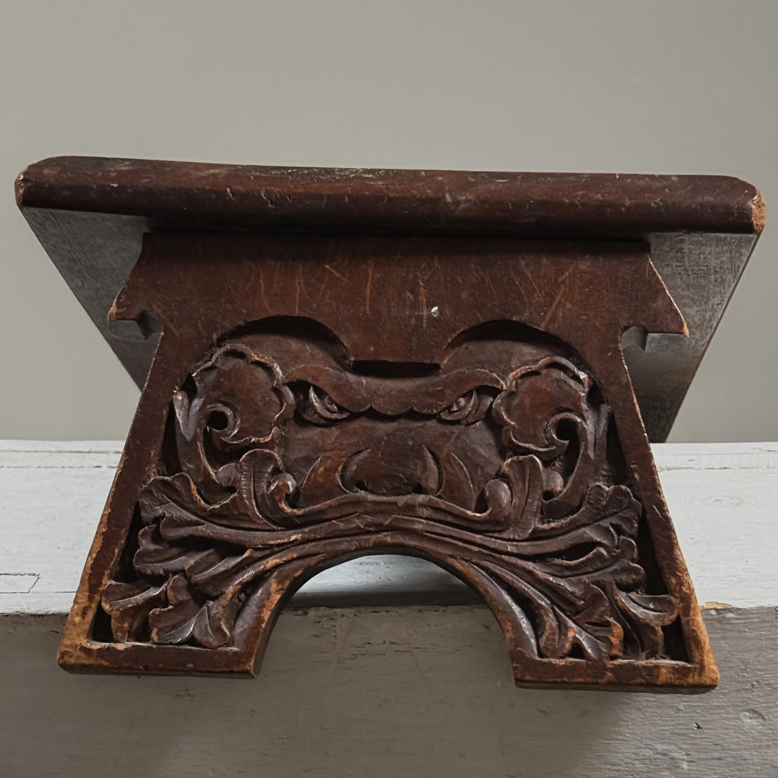 Antique hand-carved Gothic English step stool with scrolled lion and Green Man carvings