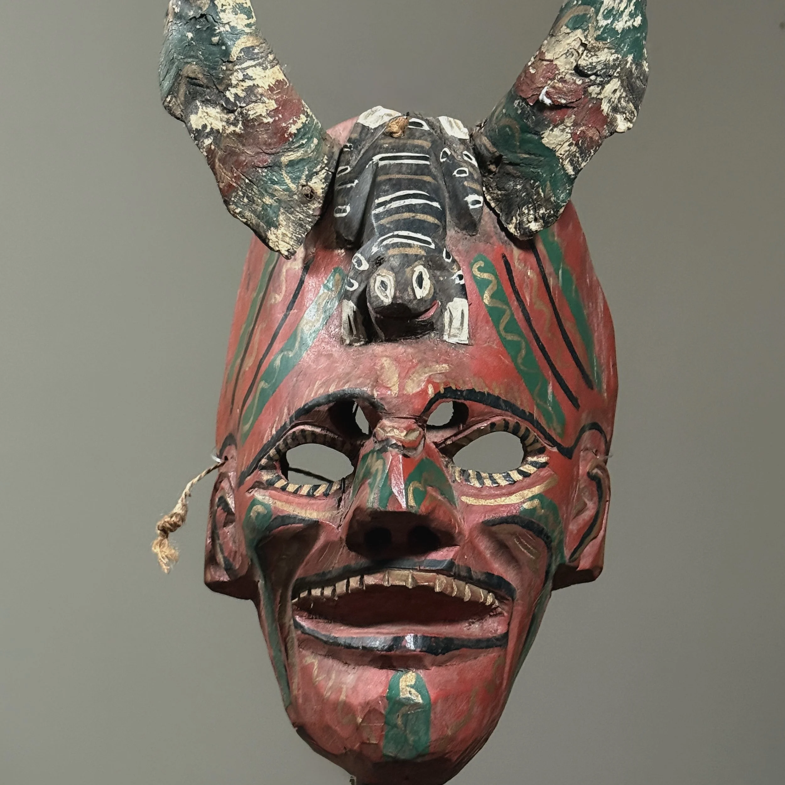 Detail of the painted polychrome surface and facial expression.