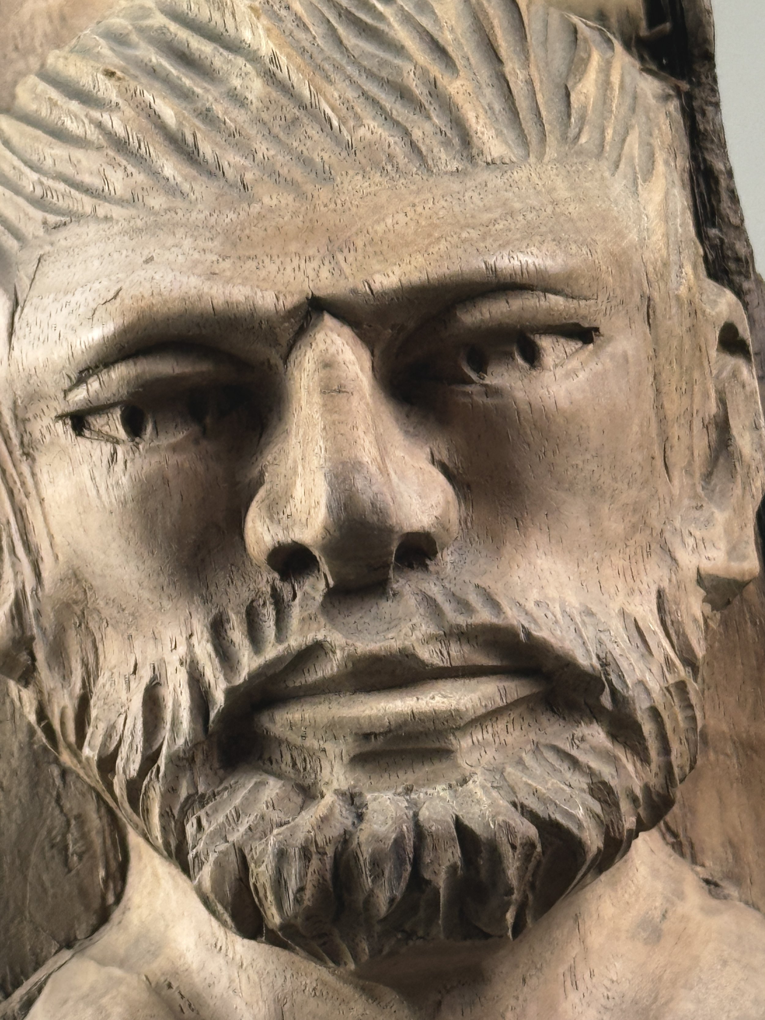 Vintage hand-carved folk art portrait of a bearded man sculpture