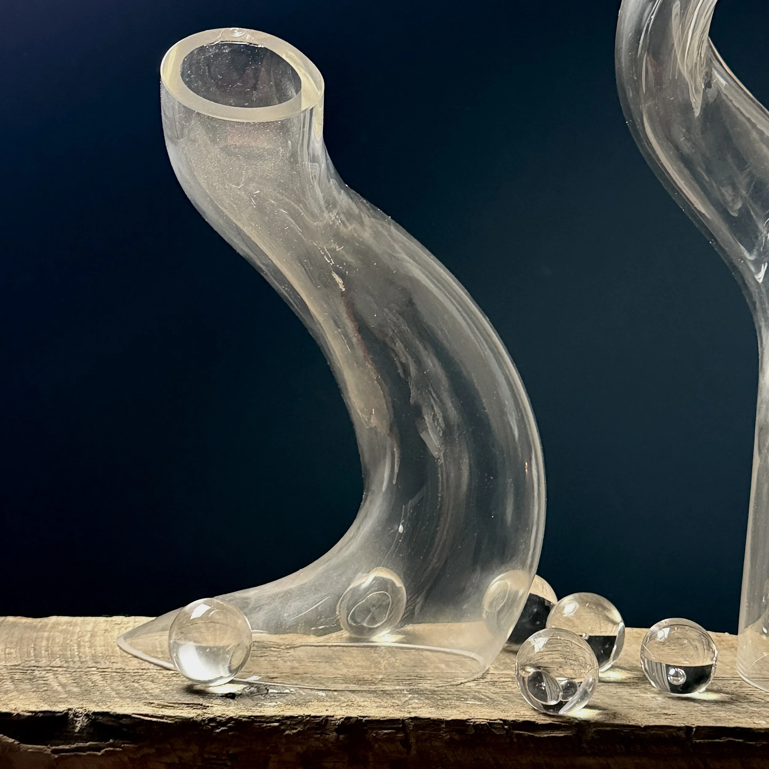 Medium glass sculpture with curved biomorphic shape and subtle opacity shifts