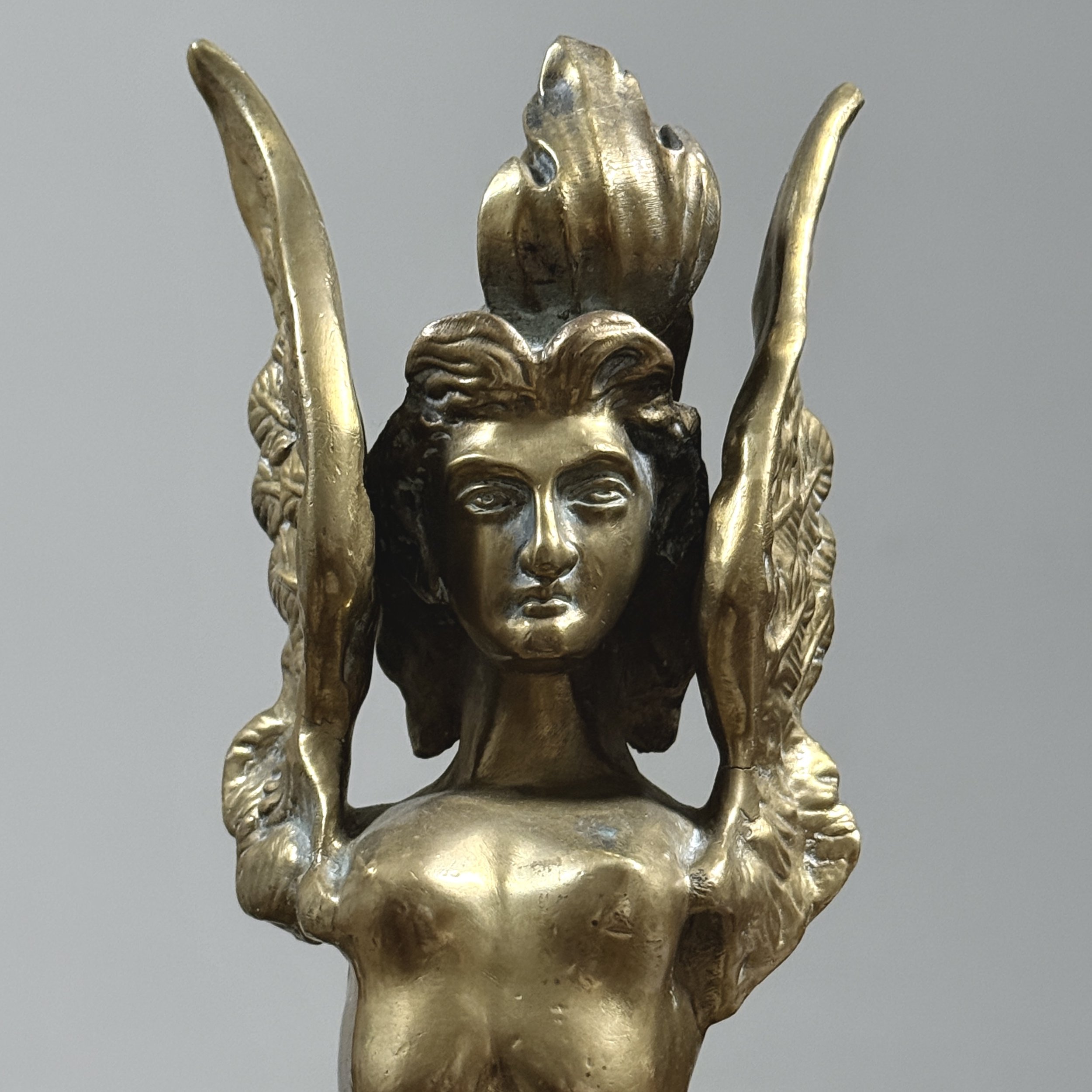 Detail view, pair of brass Melusine sculptures, Neoclassical style