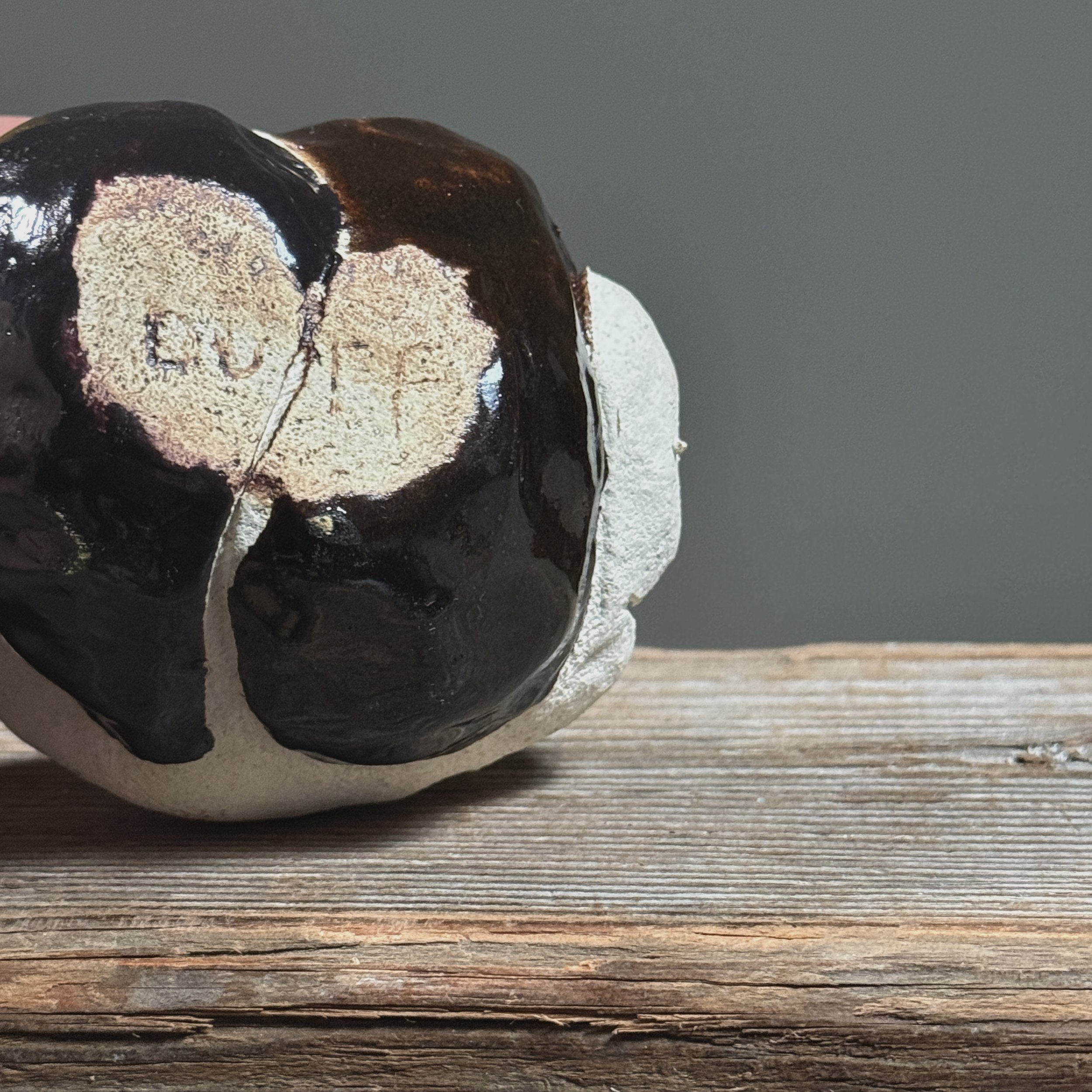 Glossy black vessel. Smooth finish. Modernist silhouette.