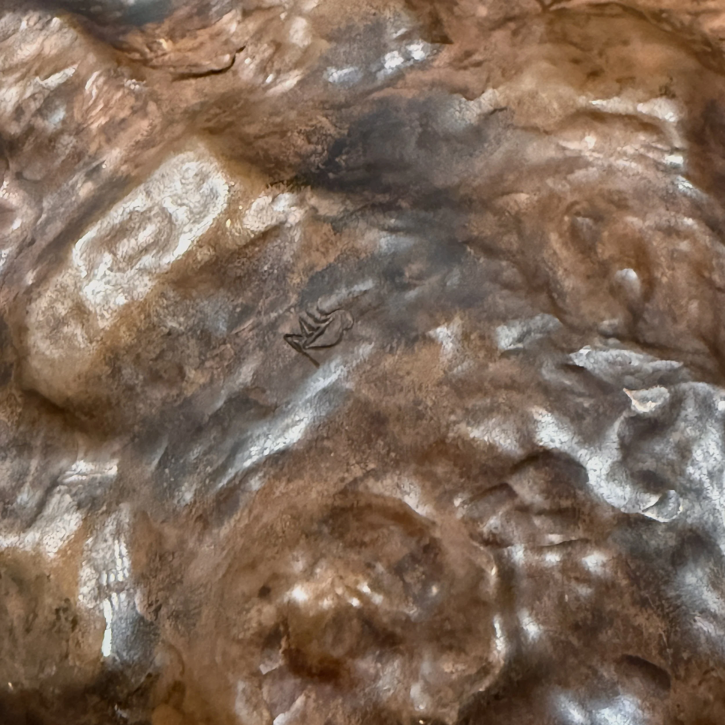 Artist’s cypher engraved on the bottom.