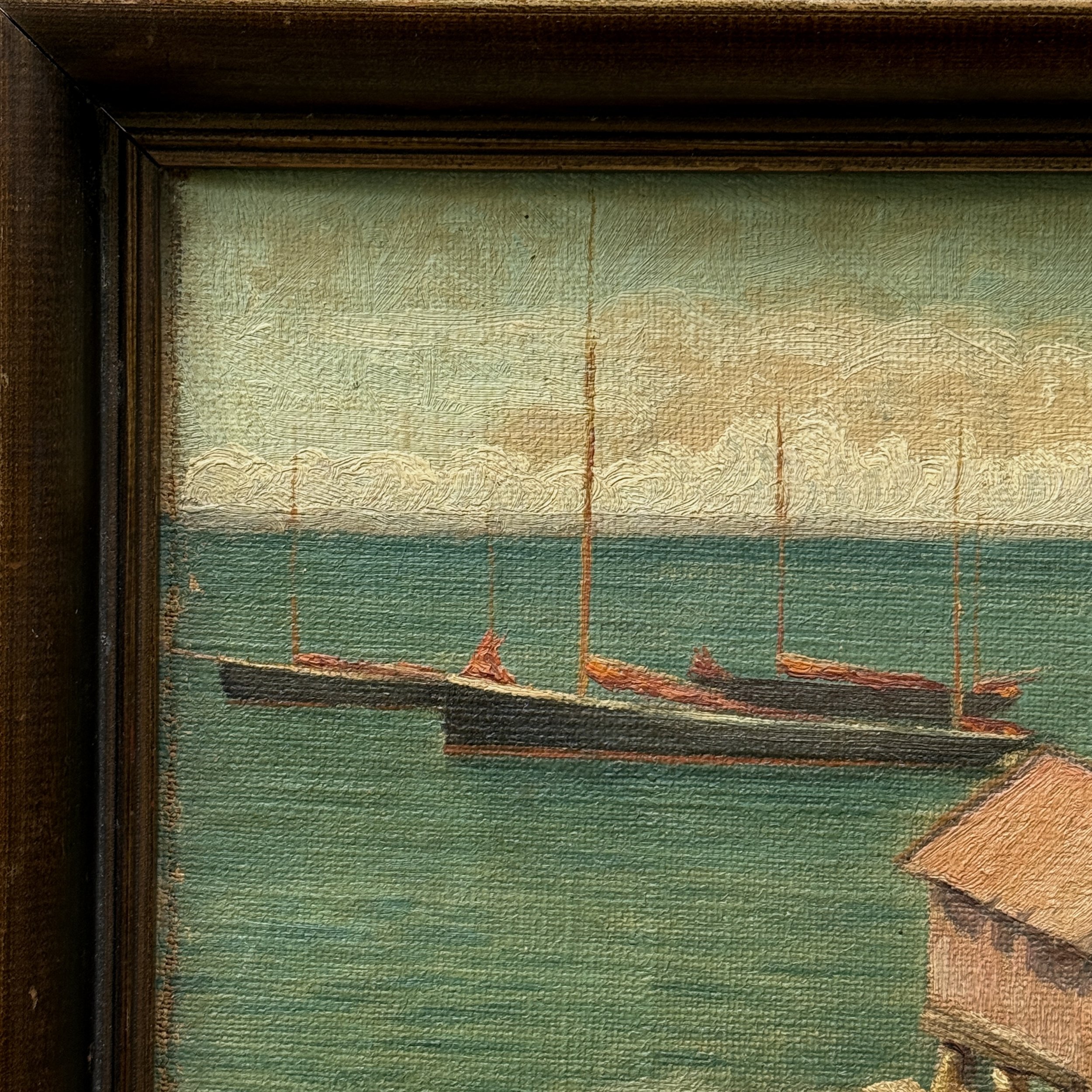 Detail view of boats in harbor and fish nets hanging on shore in 1914 Folk Art seascape, oil on canvas