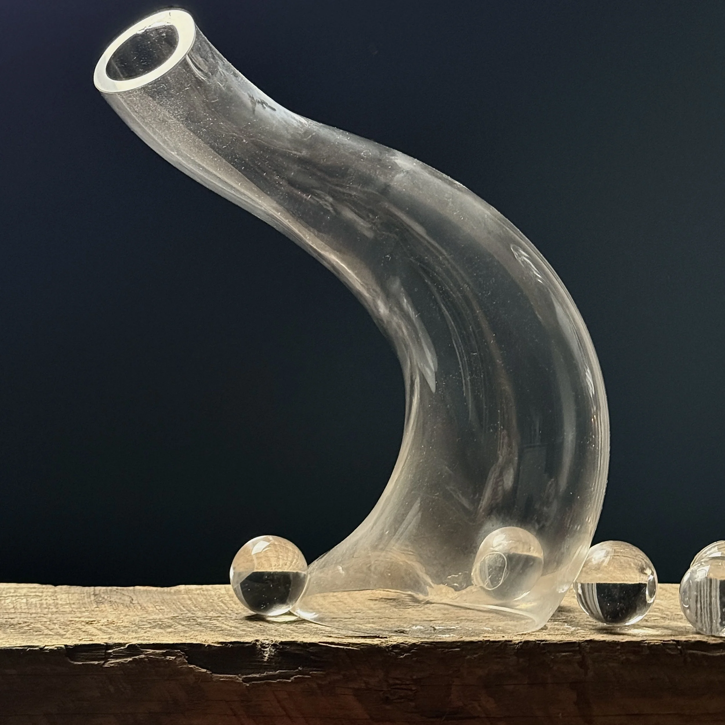 Medium glass sculpture with curved biomorphic shape and subtle opacity shifts