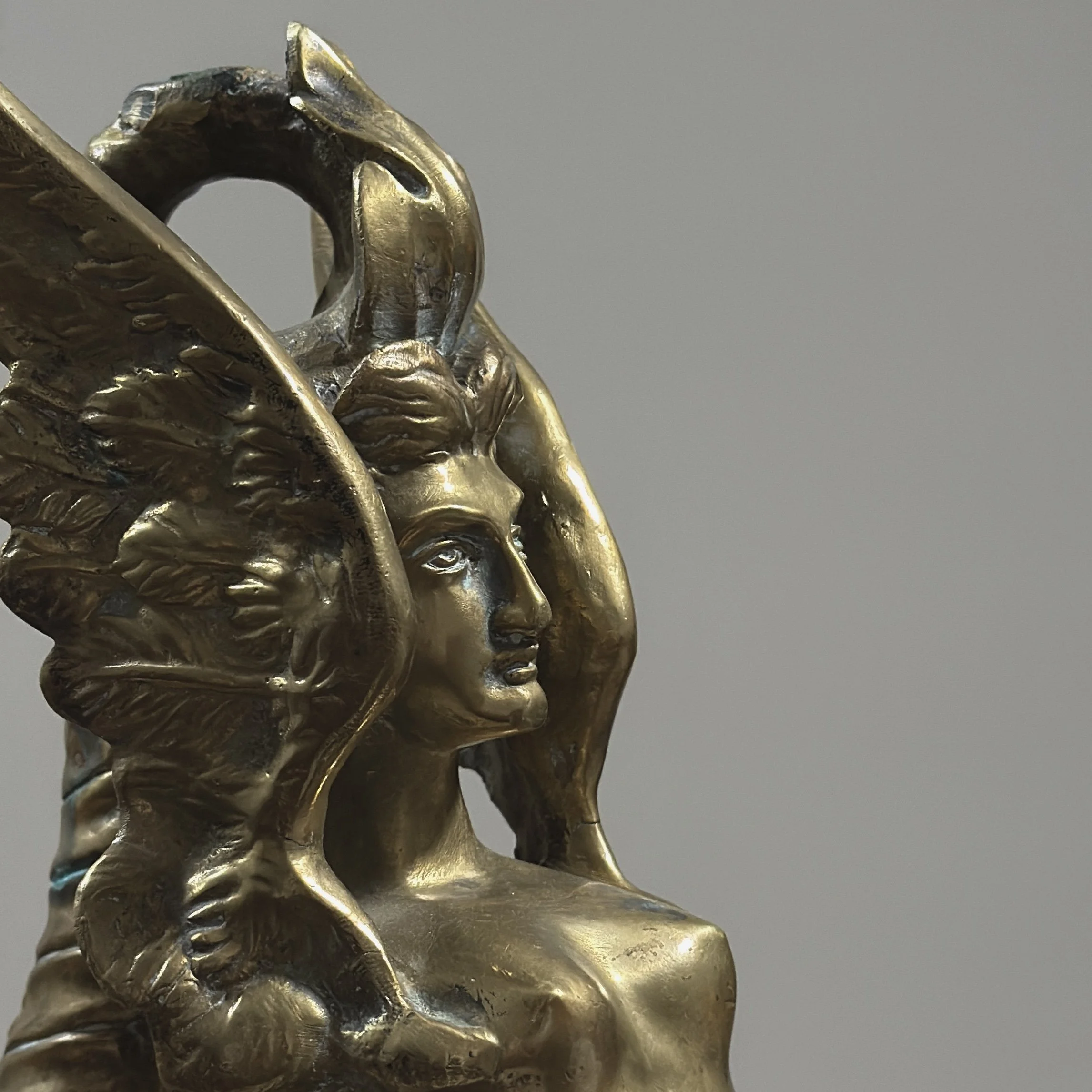 Detail view, pair of brass Melusine sculptures, Neoclassical style