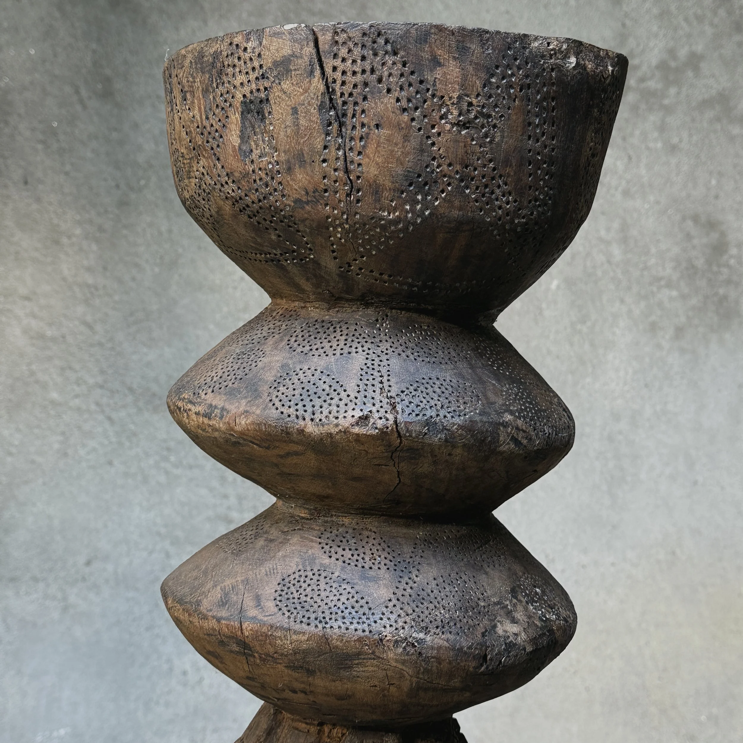 Stippled surface detail on carved wood top