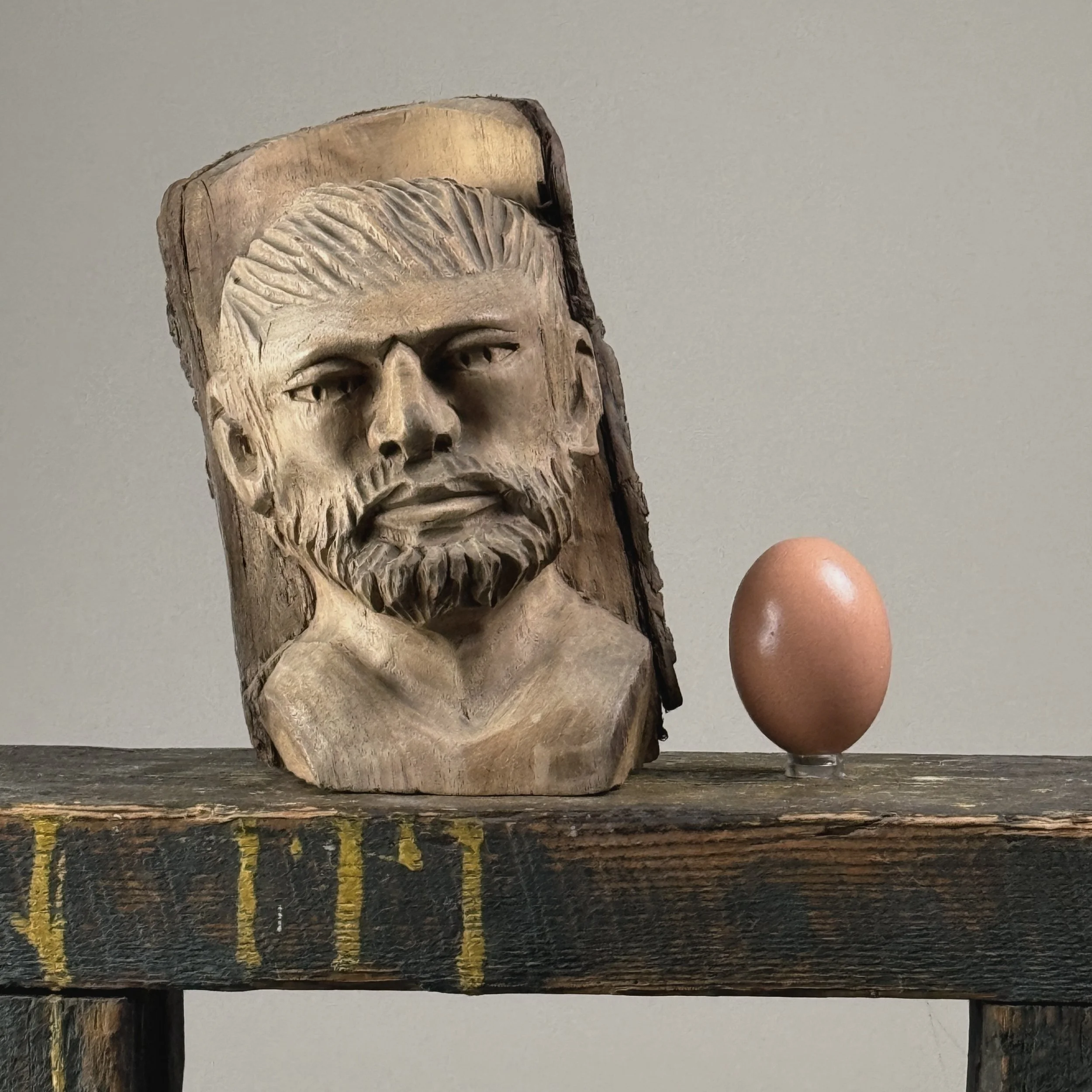 Vintage hand-carved folk art portrait of a bearded man sculpture