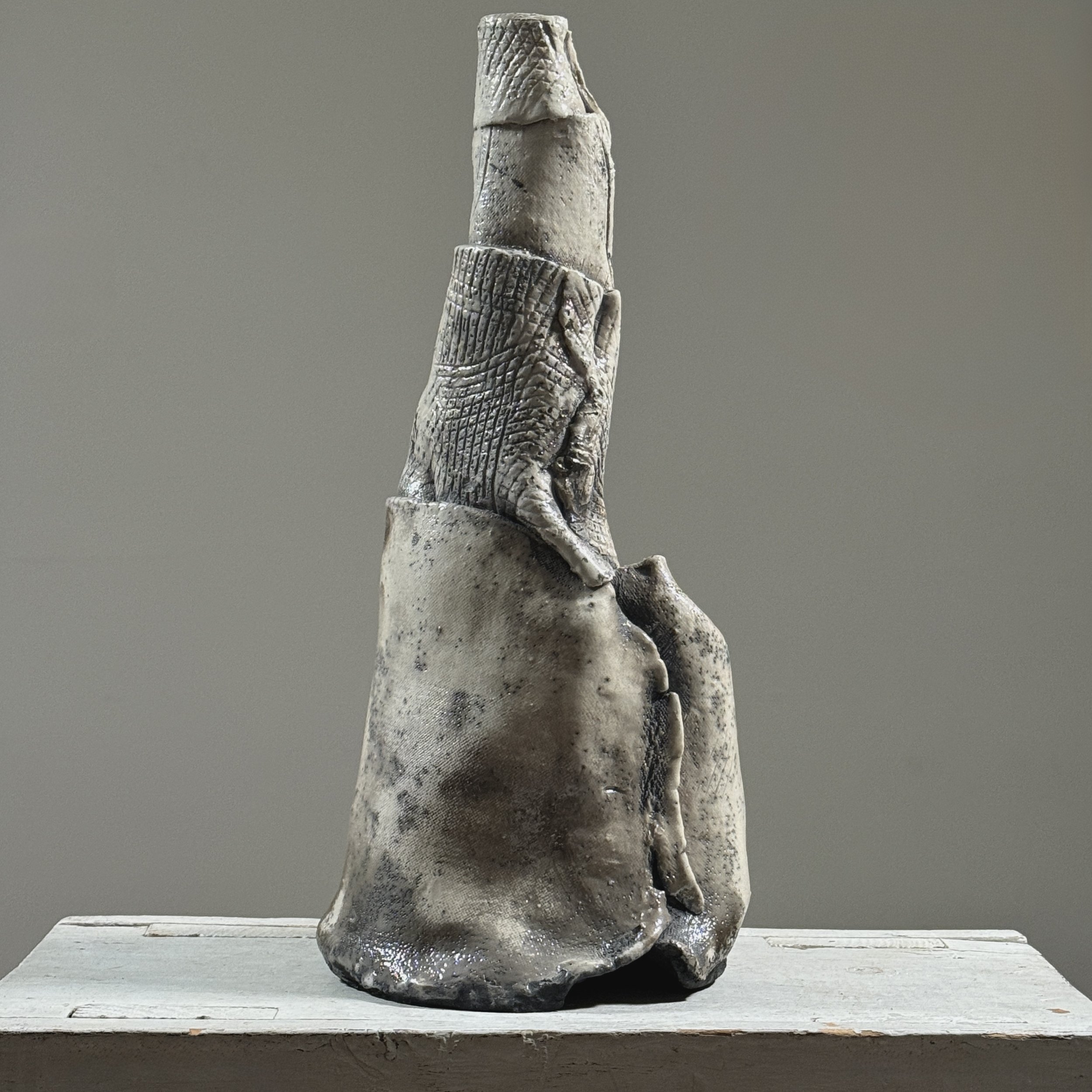 Postmodern abstract raku fired white glazed ceramic vessel