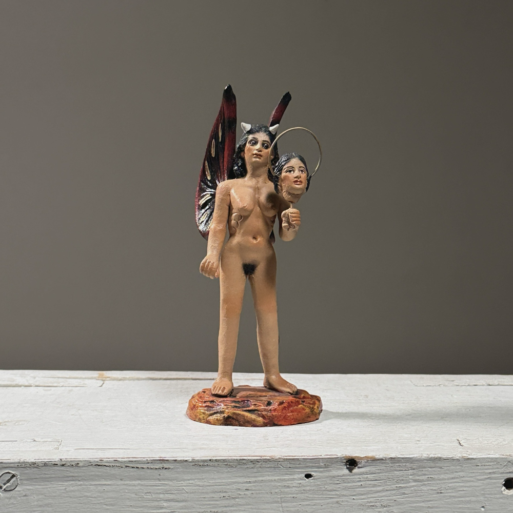 Full sculpture on white background. Unsigned. Good condition.