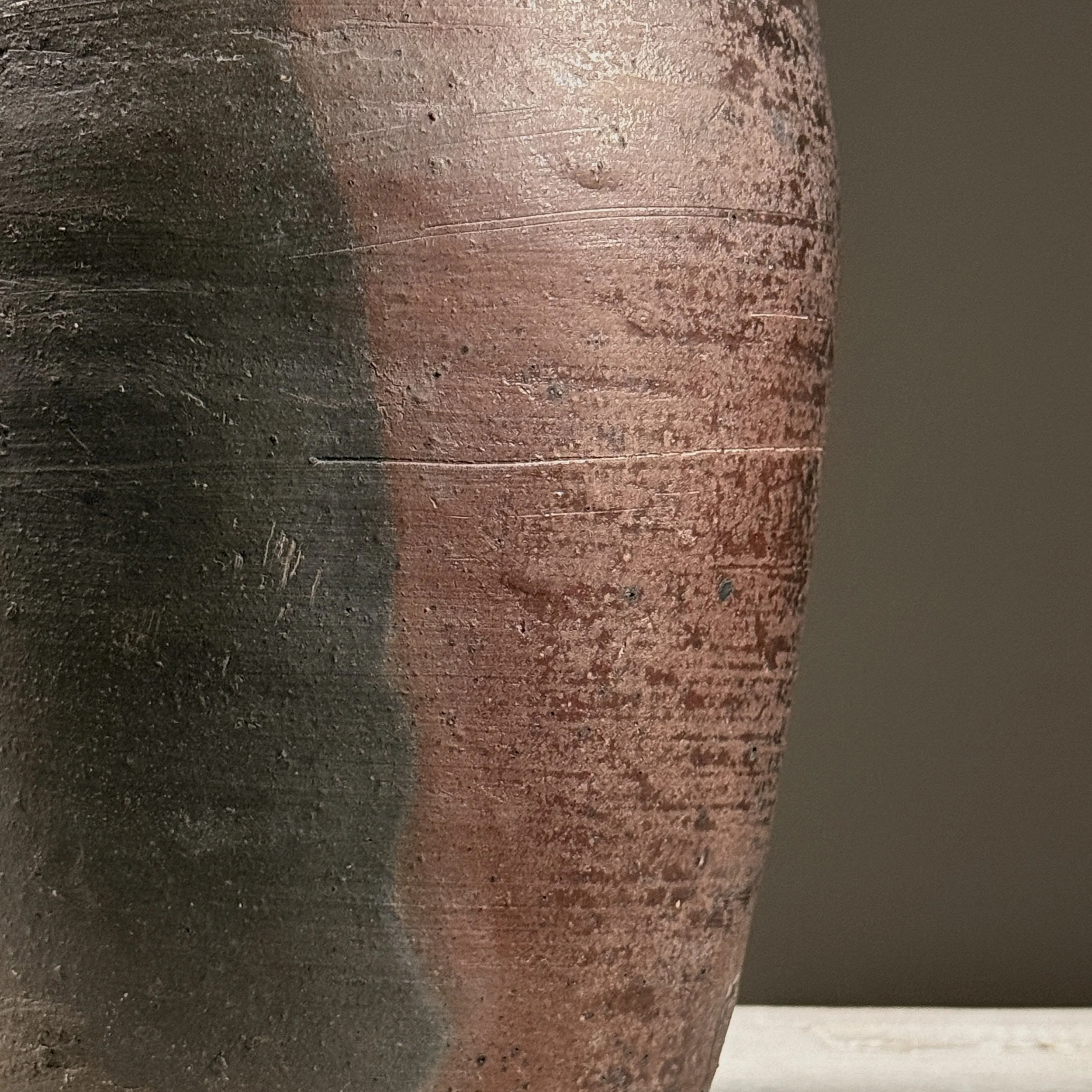 Close-up of hand-built construction and textured surface.