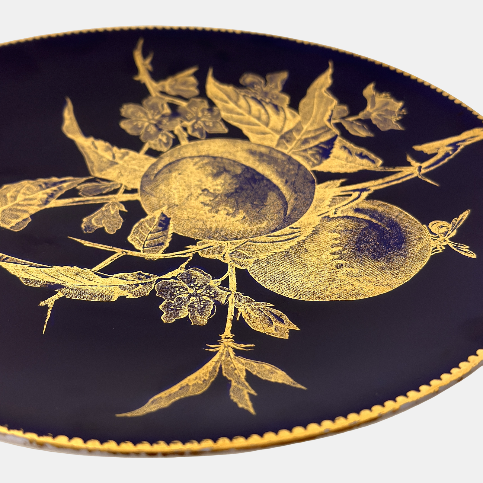 Pair of Brownfield English porcelain Aesthetic period plates, cobalt and gold, chestnut and peach motifs