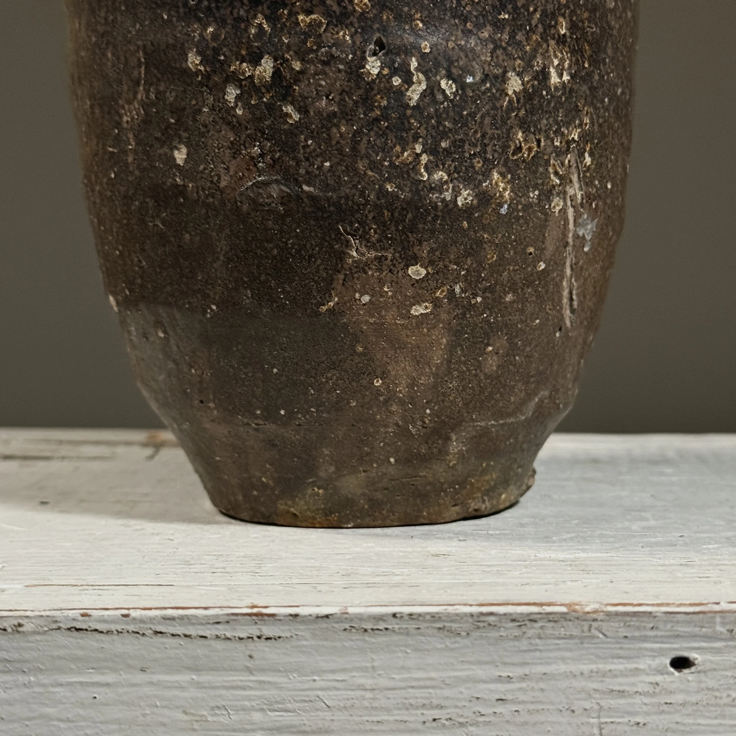 Detail of the brown glaze surface and subtle variations in color and texture.