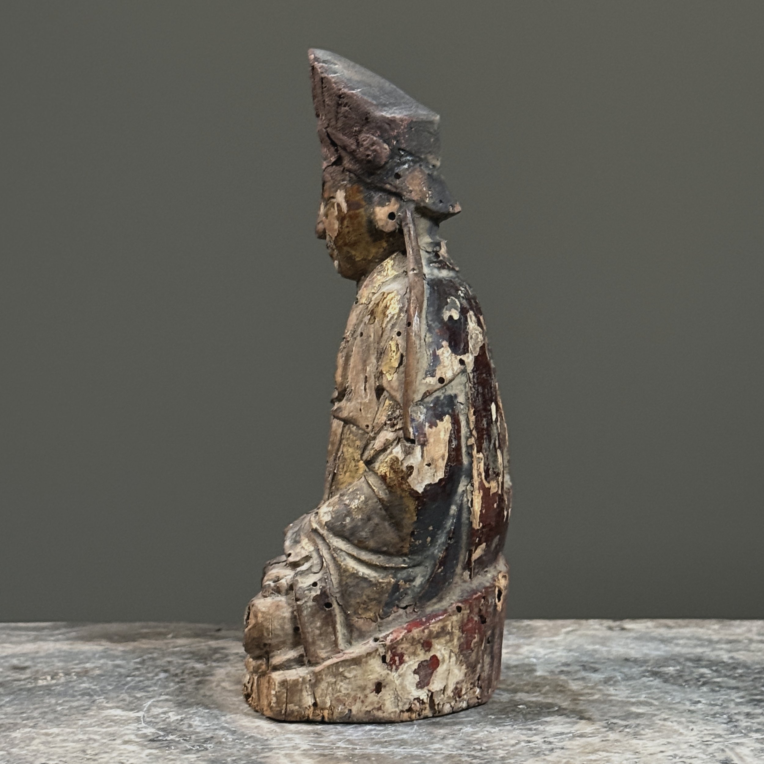 Side profile showing the figure's proportions and depth.