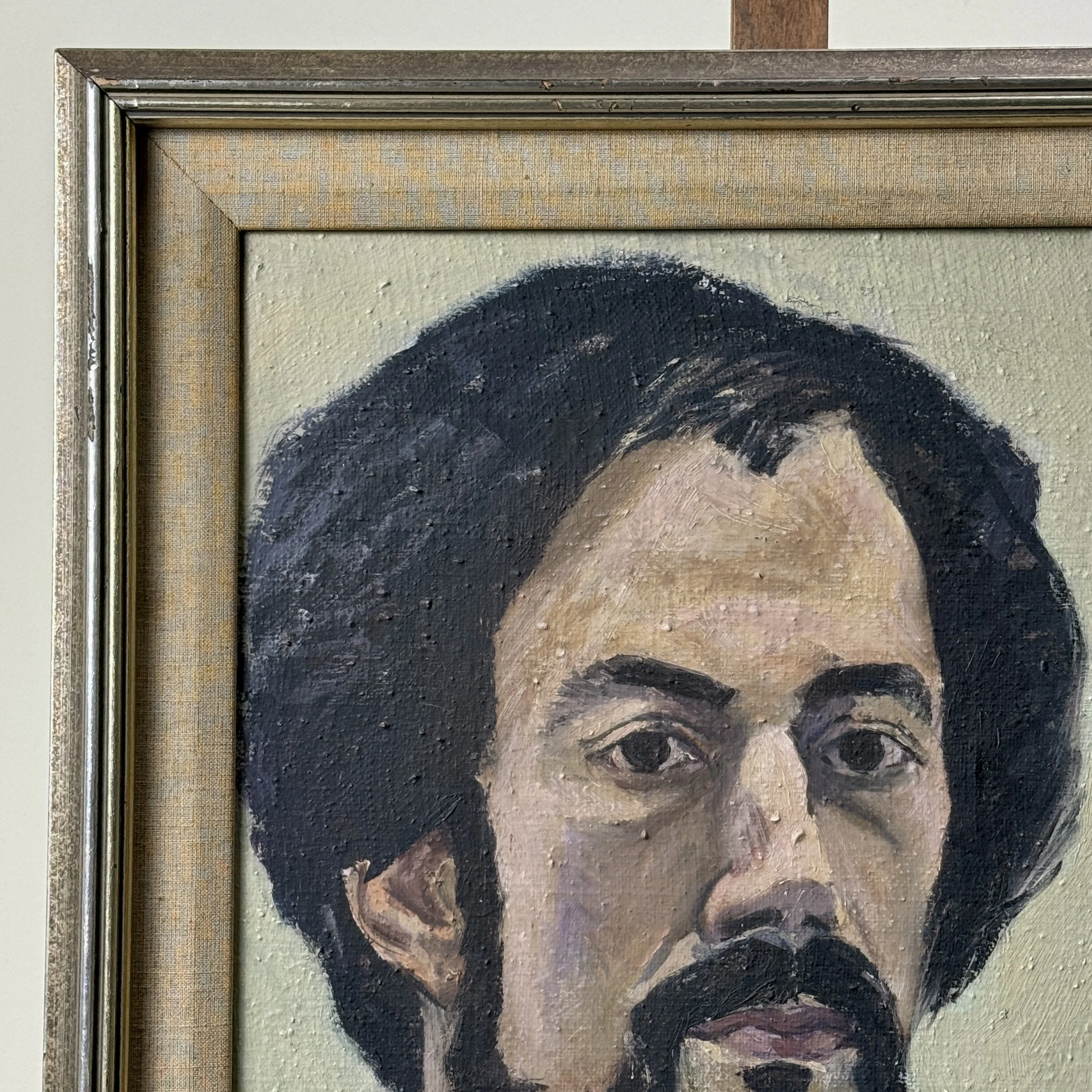 Frame detail. Metal frame. Linen trim. Light staining present.