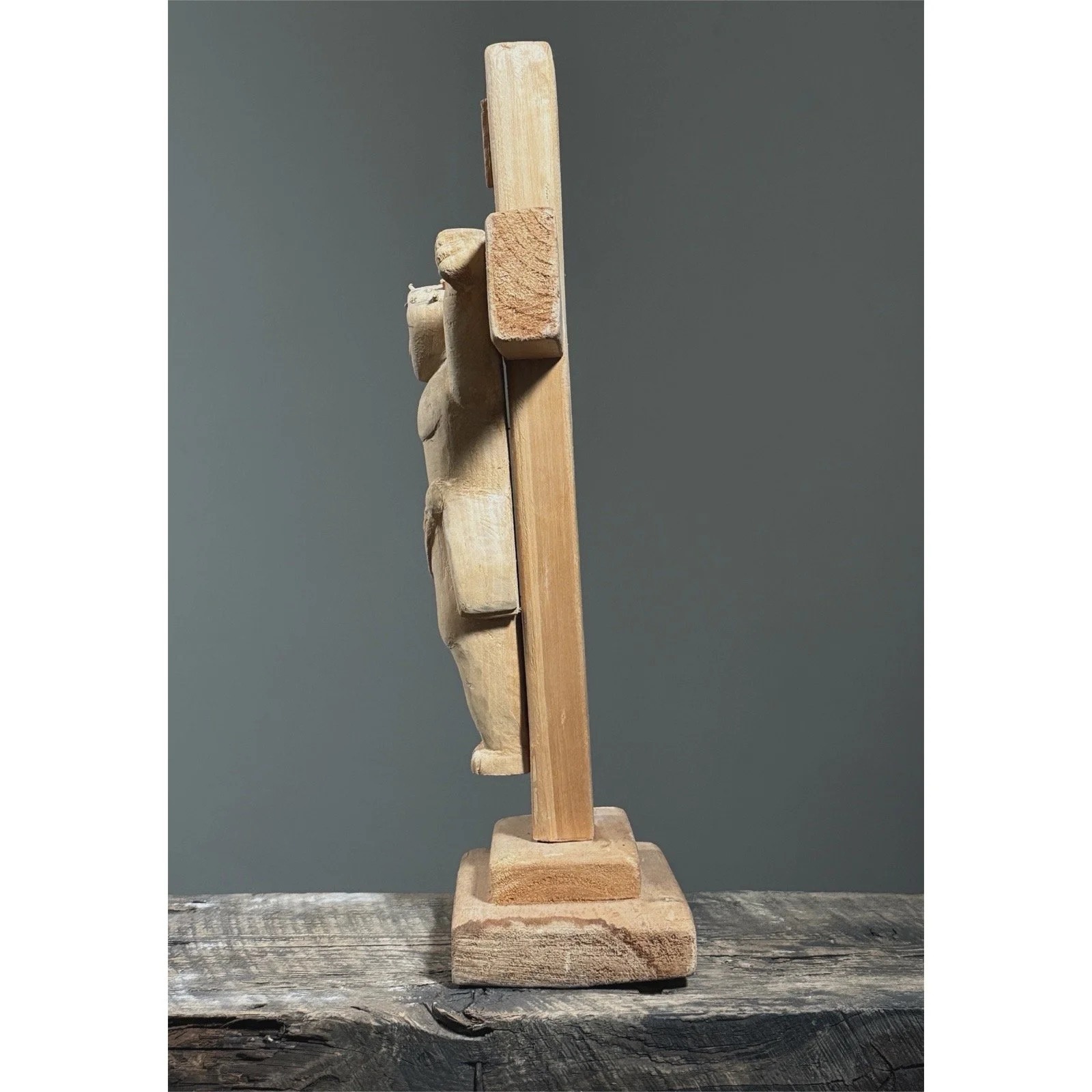 Vintage European hand-carved wooden crucifix sculpture side view