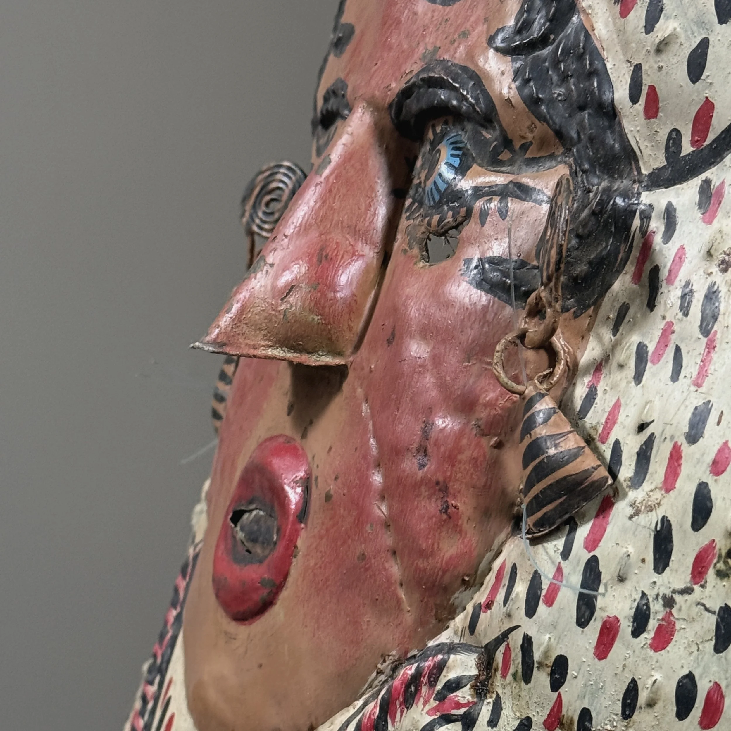 Side view of polychrome Guerrero folk art mask