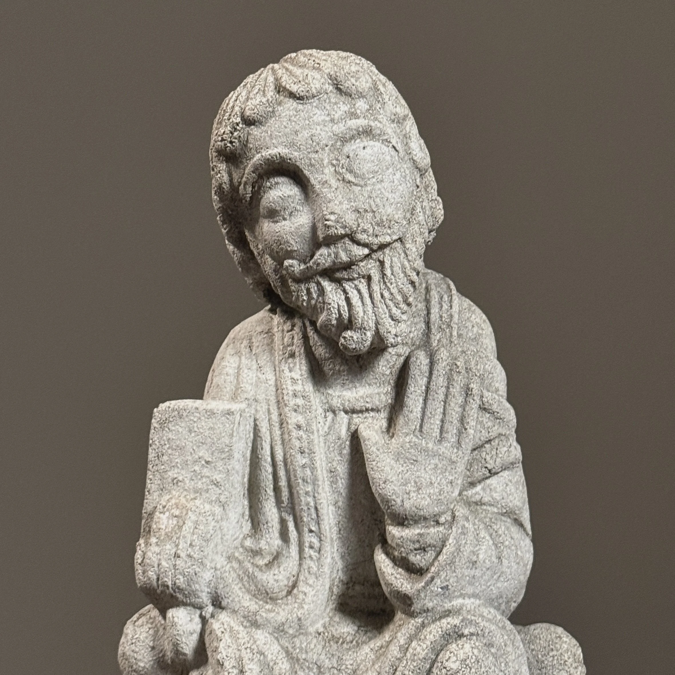 Tight shot of the head of the sculpture.