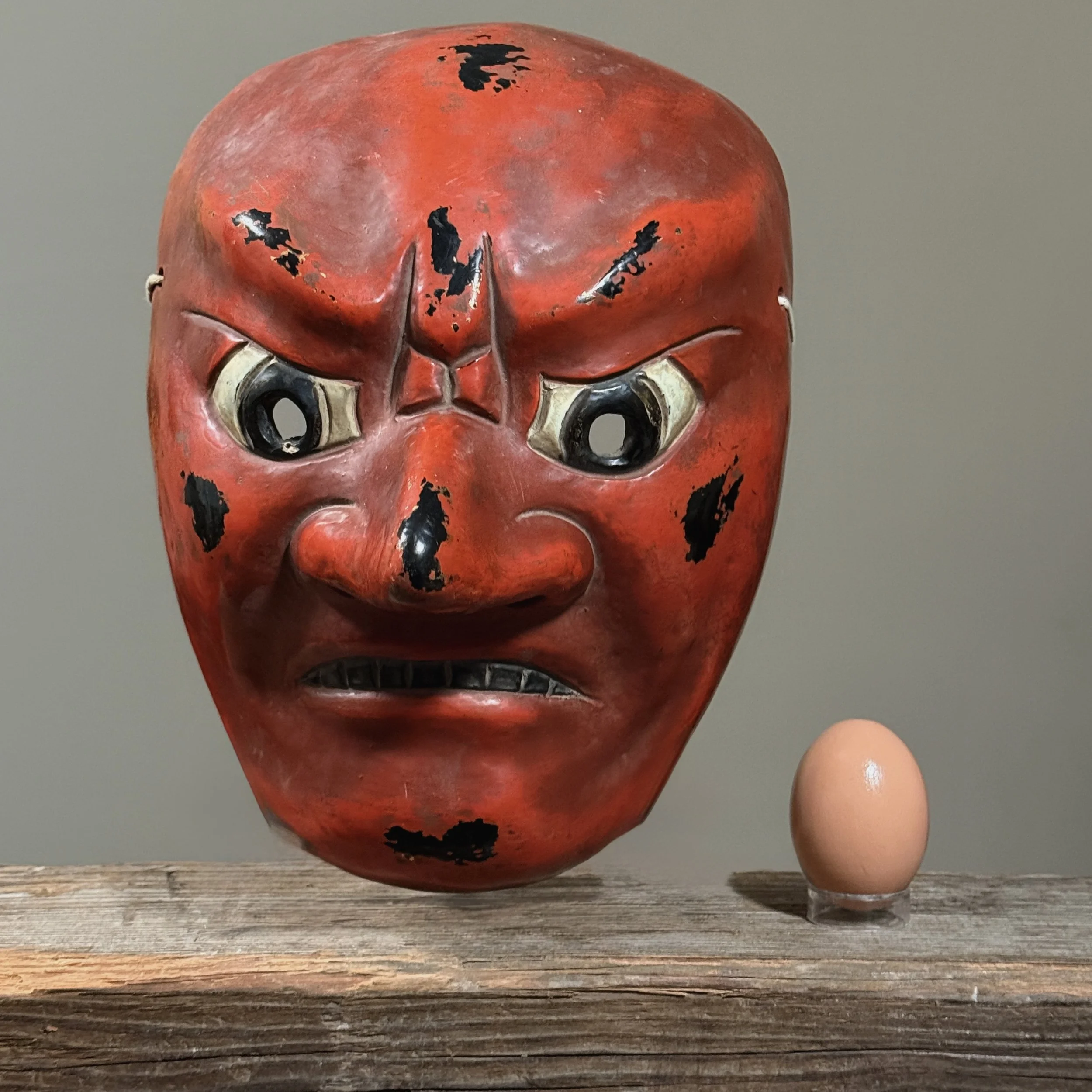 View of mask with an egg for size reference.