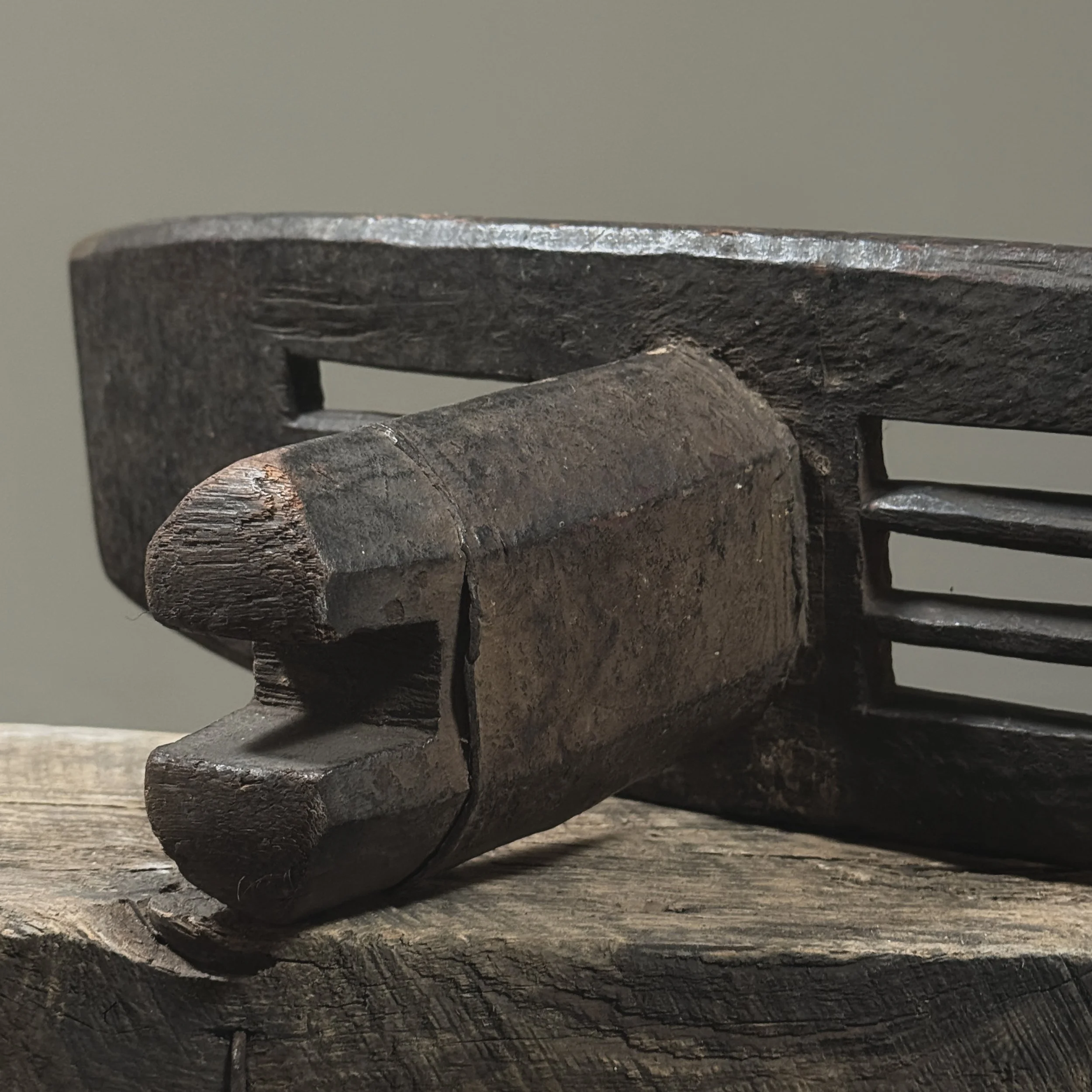 Hand-carved African backrest with wear