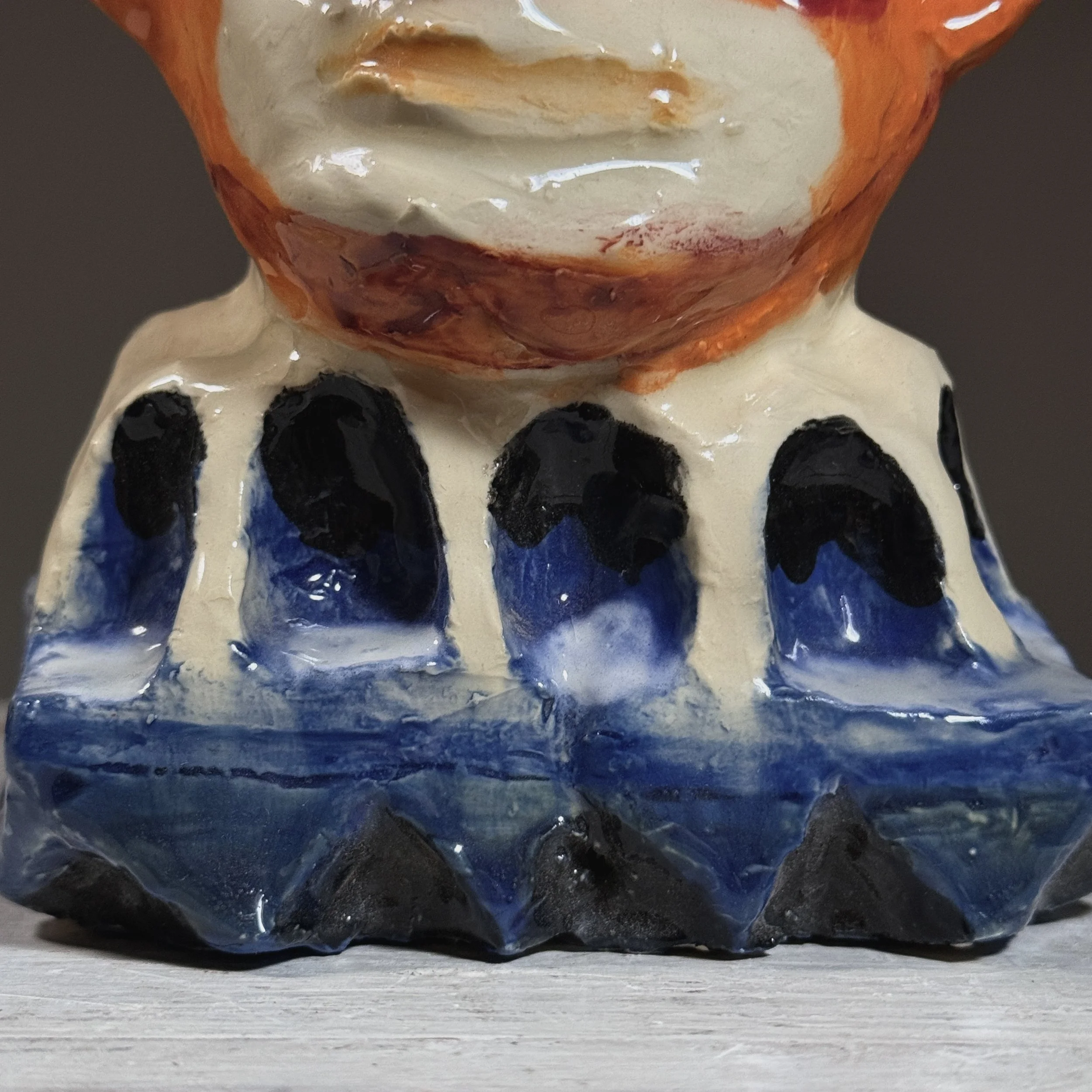 Macro detail of polychrome paint application and plaster surface texture