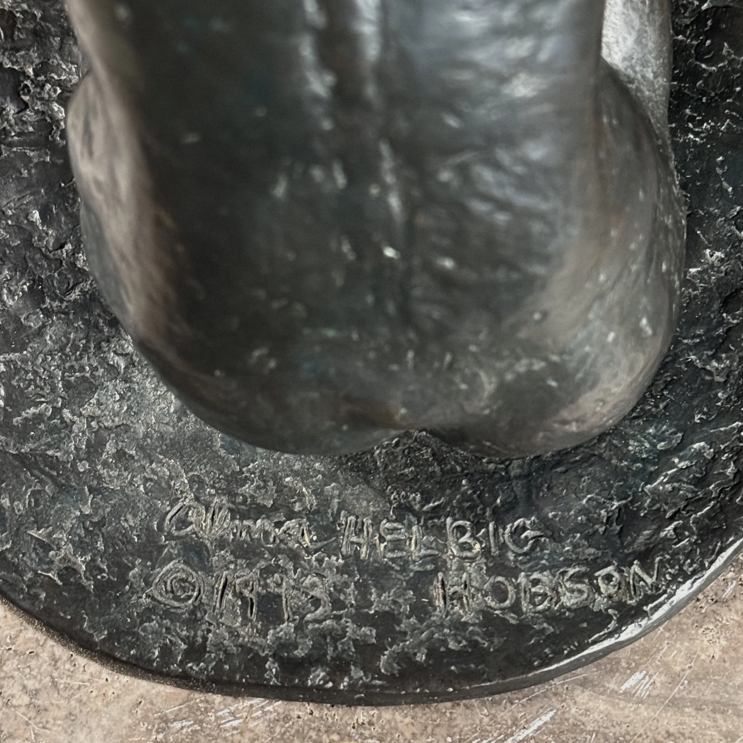 Detail of the artist's signature incised on the top of the bronze sculpture's base