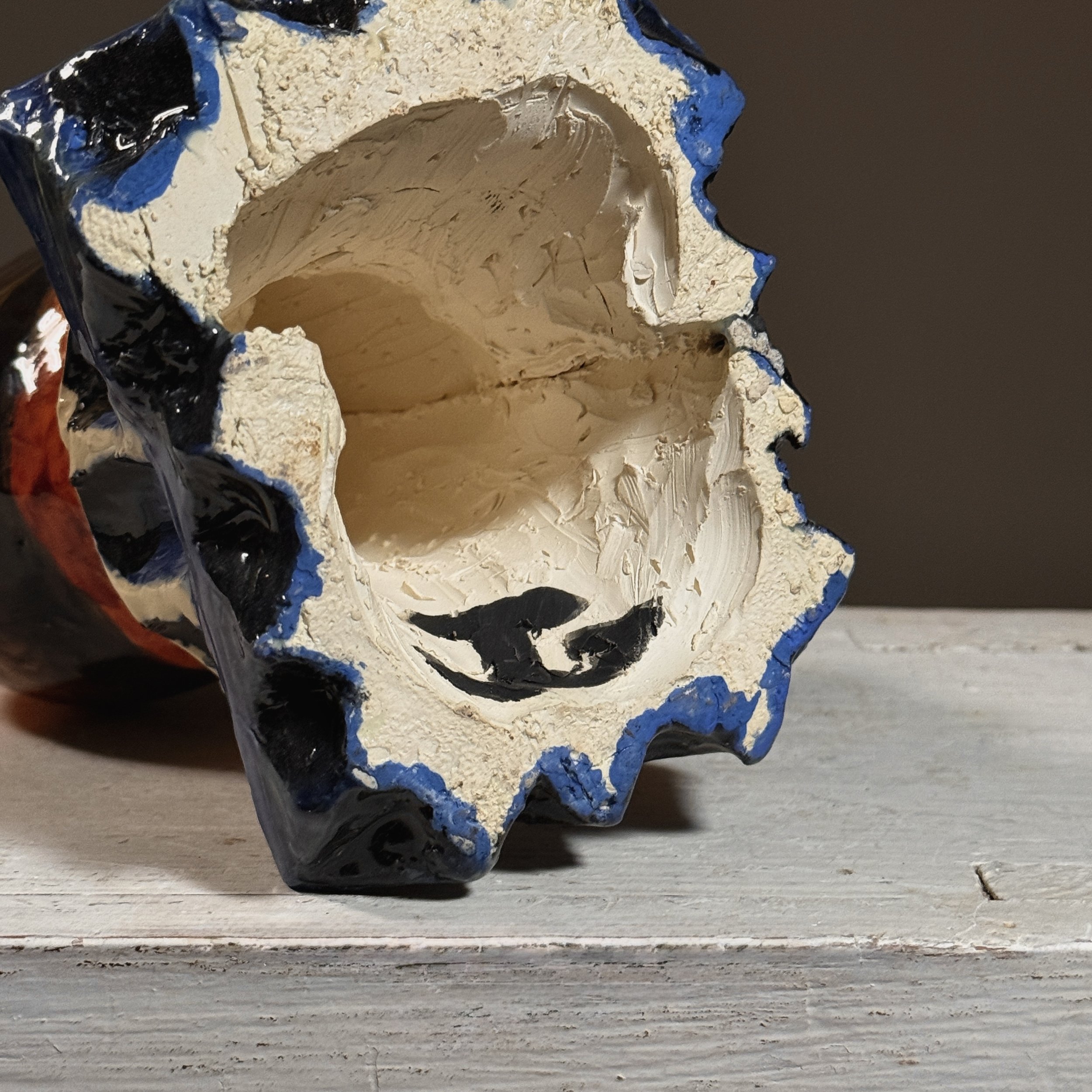 Detail of the artist's signature inscribed on the sculpture