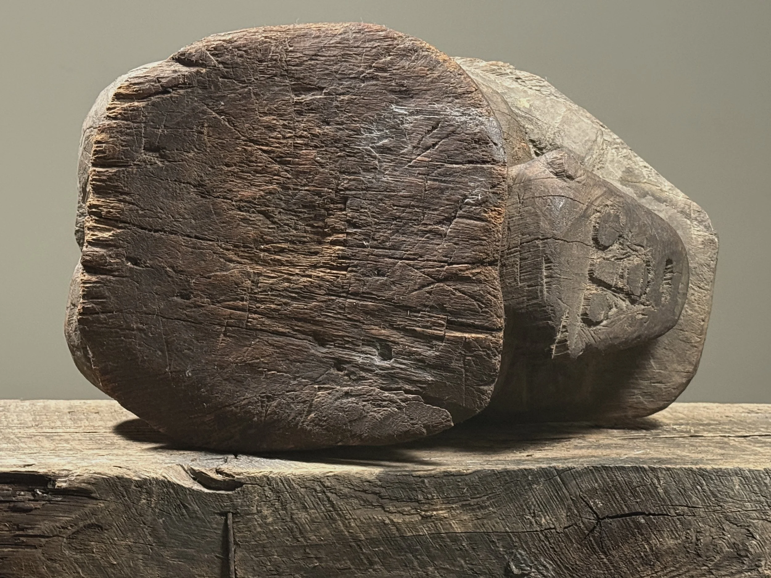 Elevated view looking down onto the carved top surface of a Papua New Guinea ceremonial stool