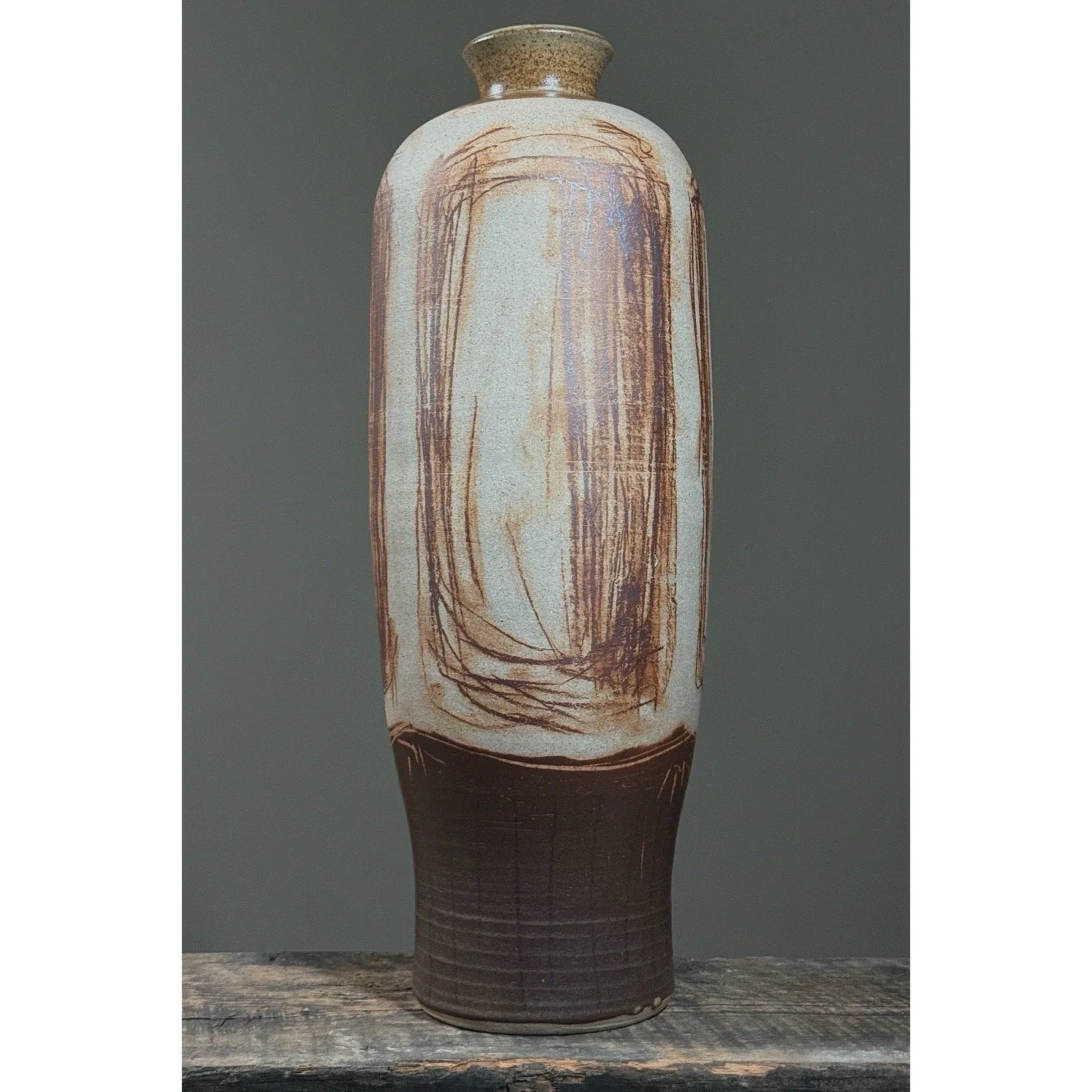 Tall beige earthenware vase with gestural brown linework
