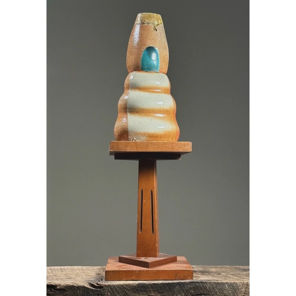 Front view of a vintage postmodernist biomorphic vase with graduating bulges.