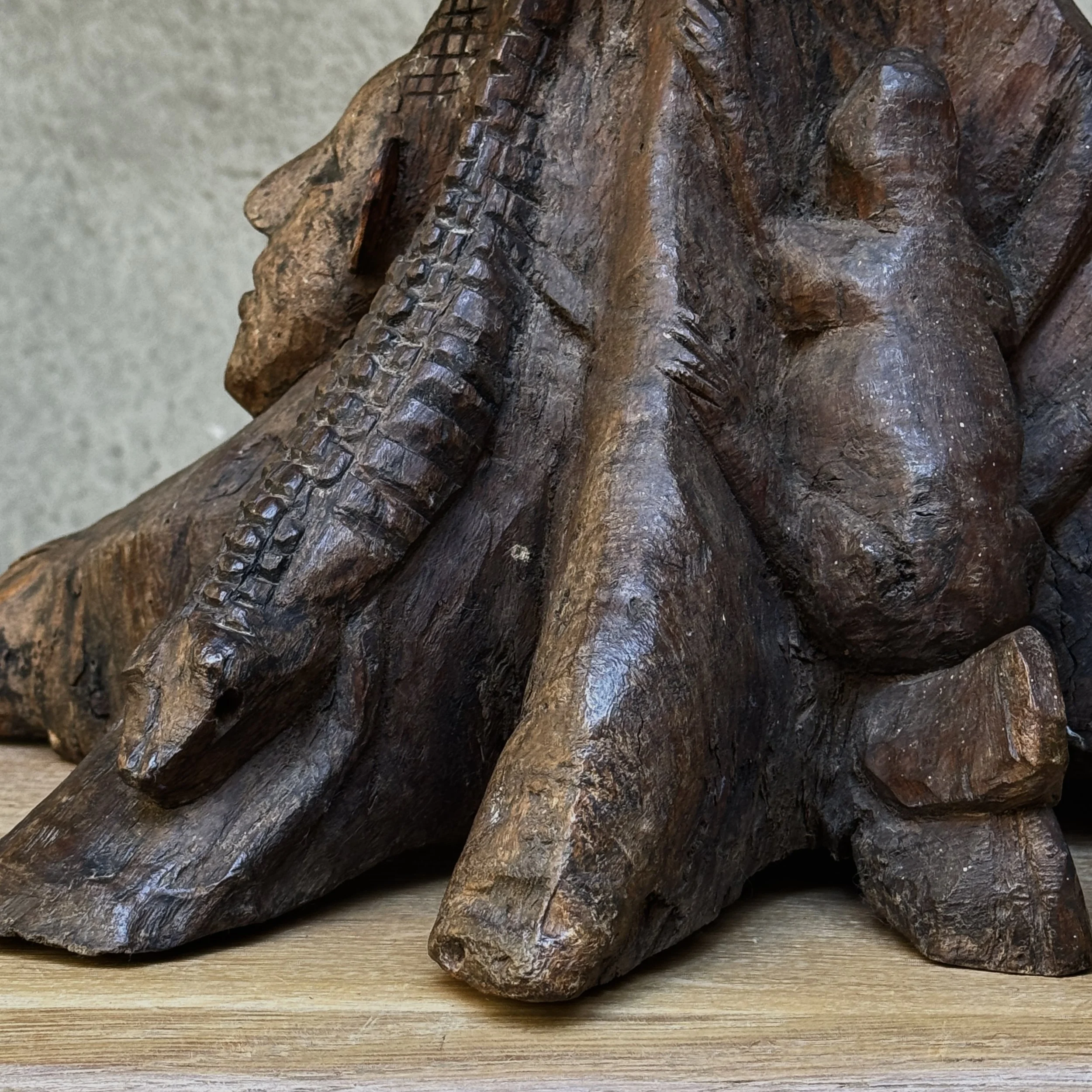 Single-block carved wooden table-like form