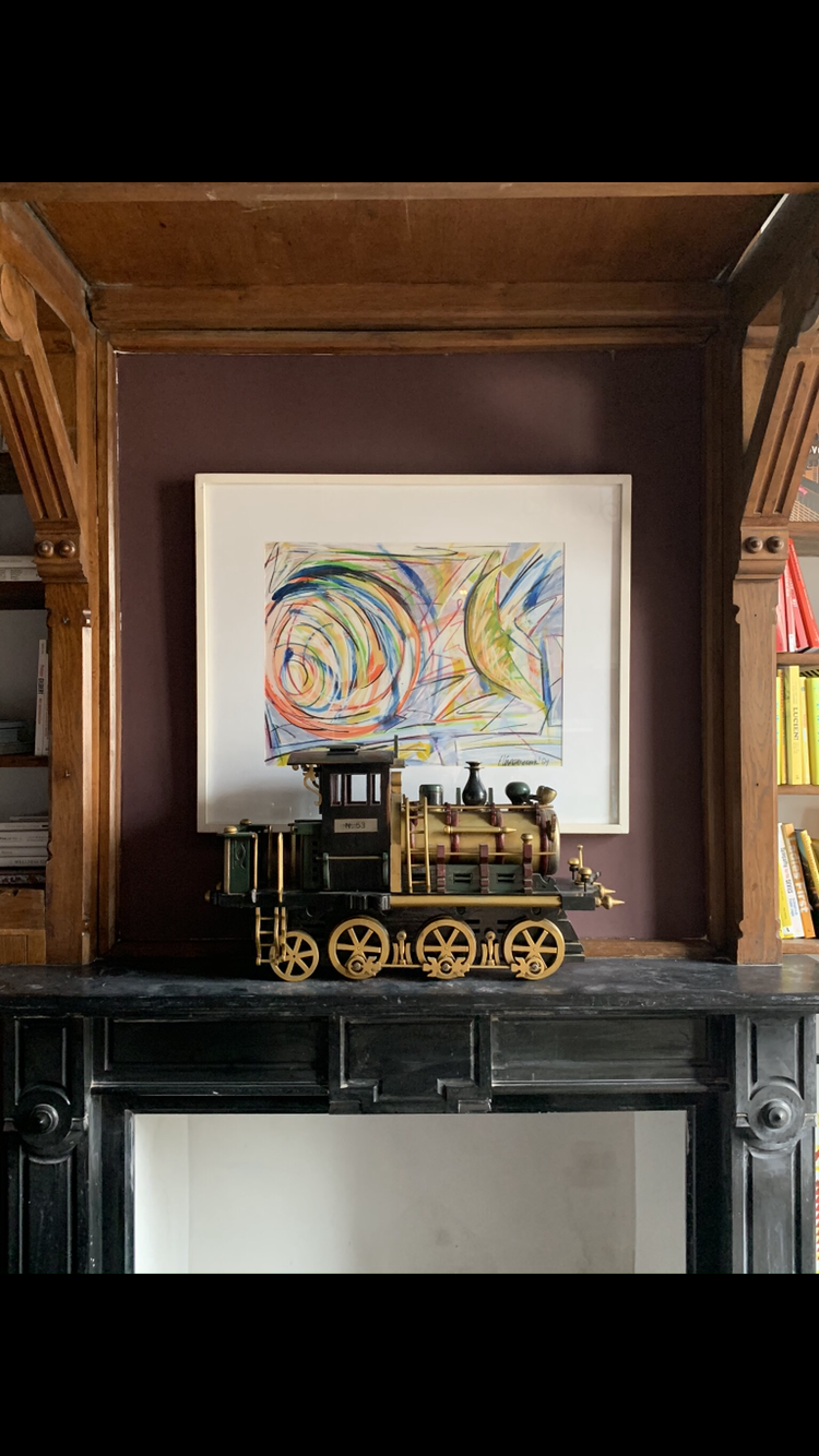 An antique toy train is combined here with a sixties artwork by Jonas de Wit.