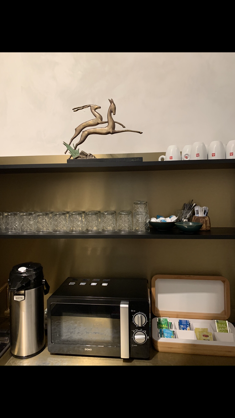 An art deco deer figurine cheers up the coffee corner on one of the floors.
