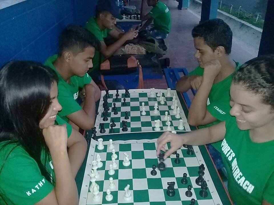 Teens in El Salvador playing chess