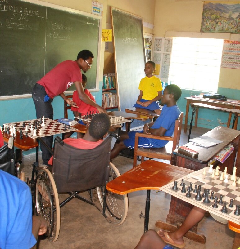 Children playing and learning chess at the Katwe Chess Center