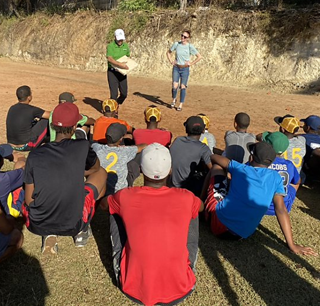 Coach Dan shares his baseball know-how with campers in the DR.png