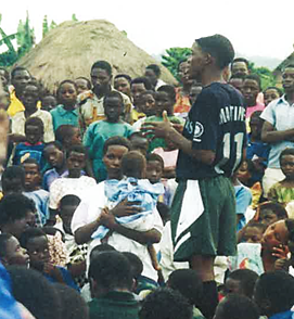 A young Aloysius speaks to villagers (1).png