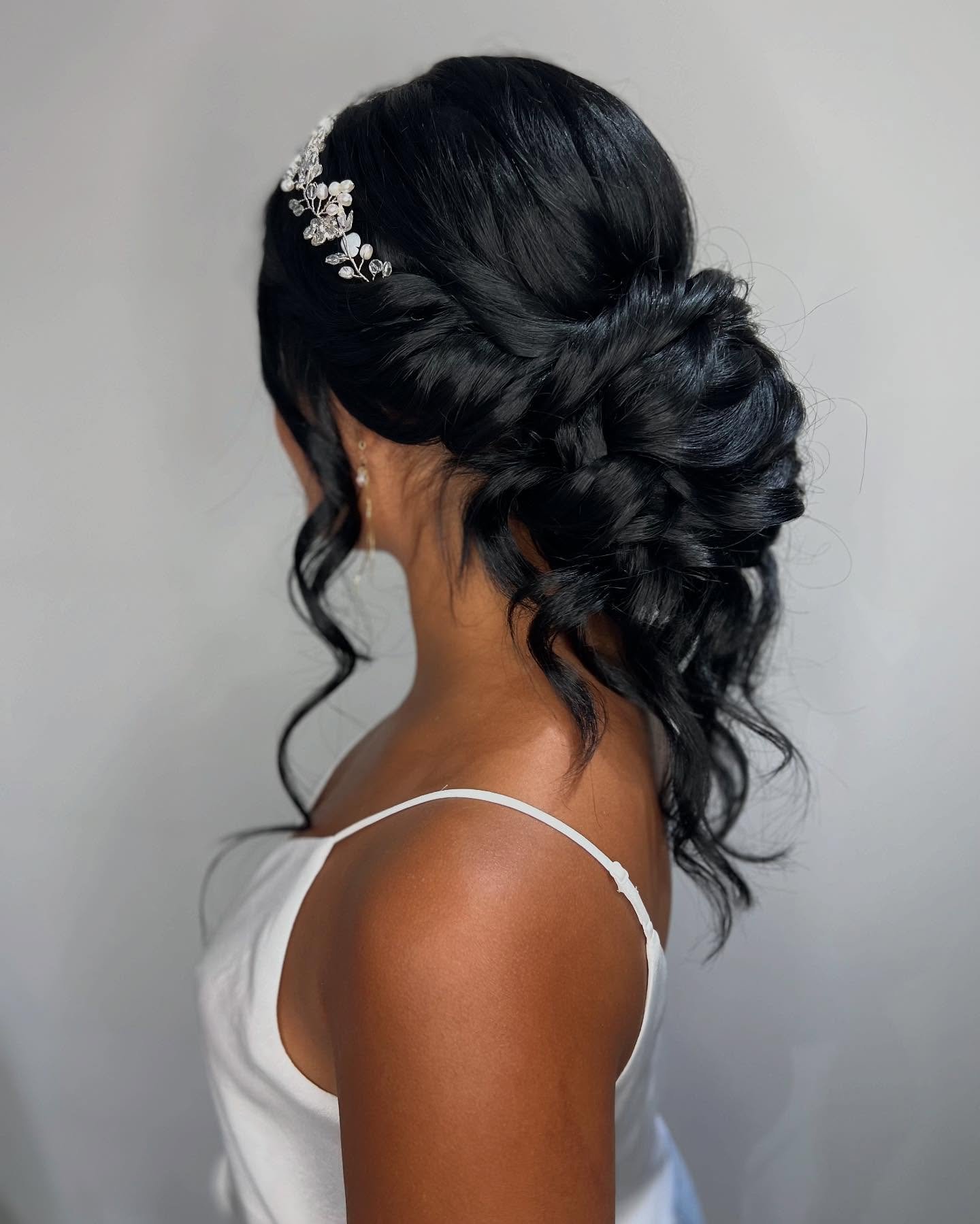 I came across this fairytale hair trial photo from 2022 in my favorites album! 

I have to say I really love this style, especially for dark hair!  It&rsquo;s sort of bridging between updo and half up.  If your dress has a lot of embellishments but y