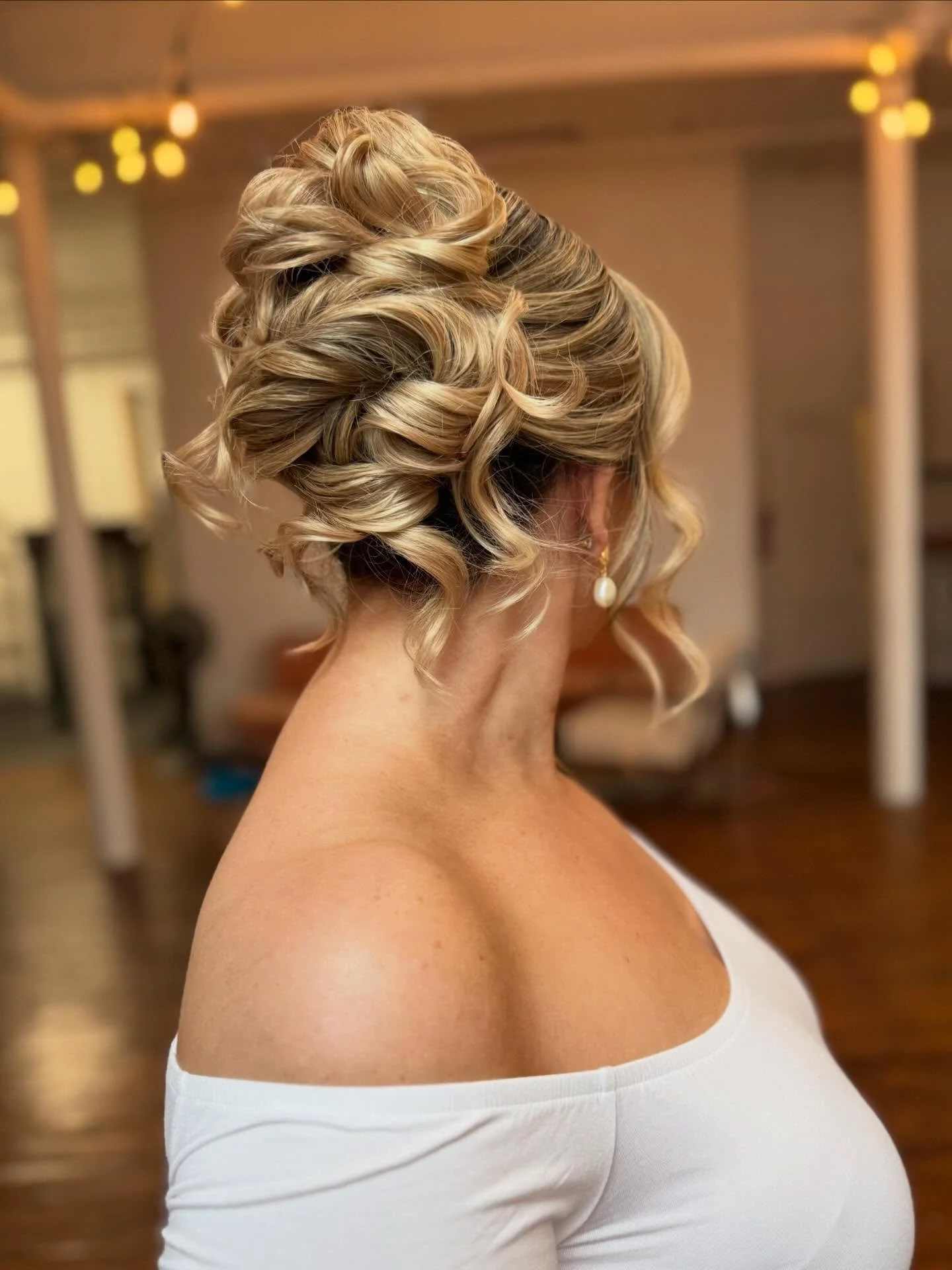 The best style for you is the one that makes you FEEL amazing!!!

The second best is a high updo with a middle part.  This is universally flattering.  It lifts your chin and jaw, elongates your neck, and you don&rsquo;t necessarily need a million pou