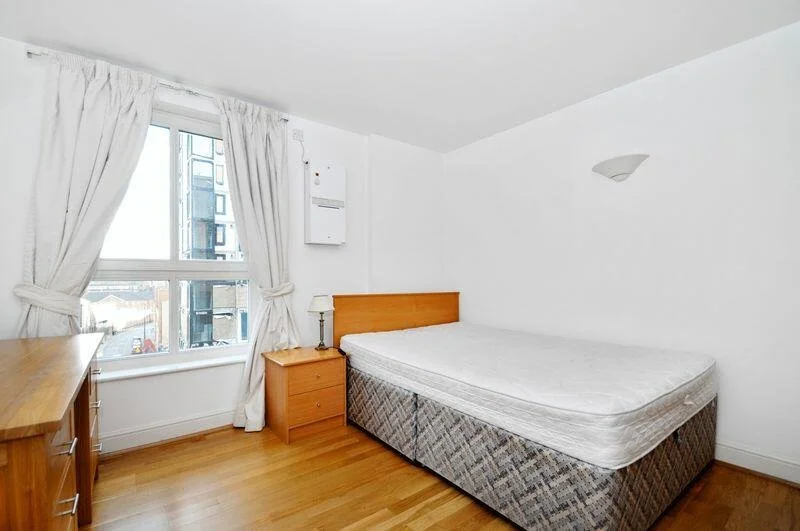 bedroom before staging looks small and drab