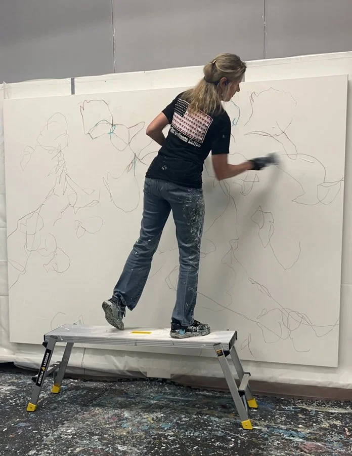 Cat Tesla  working on a 72x96 nature-inspired abstract painting.jpg