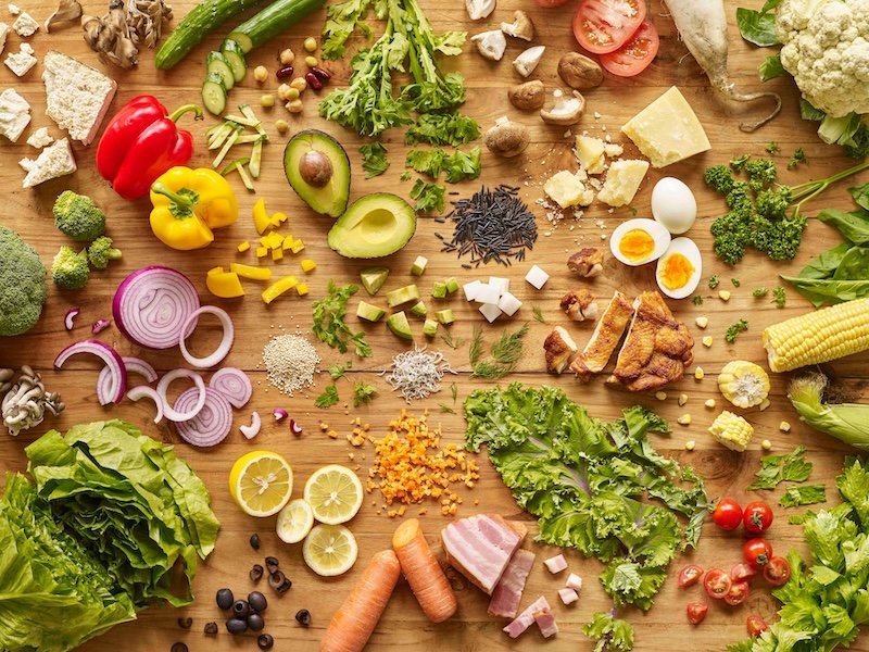 Colorful assorted chopped vegetables on a cutting board representing health of employees. Working with a depression counselor in Boston, MA can help reduce work burnout. | 02481 | 02493 | 01890
