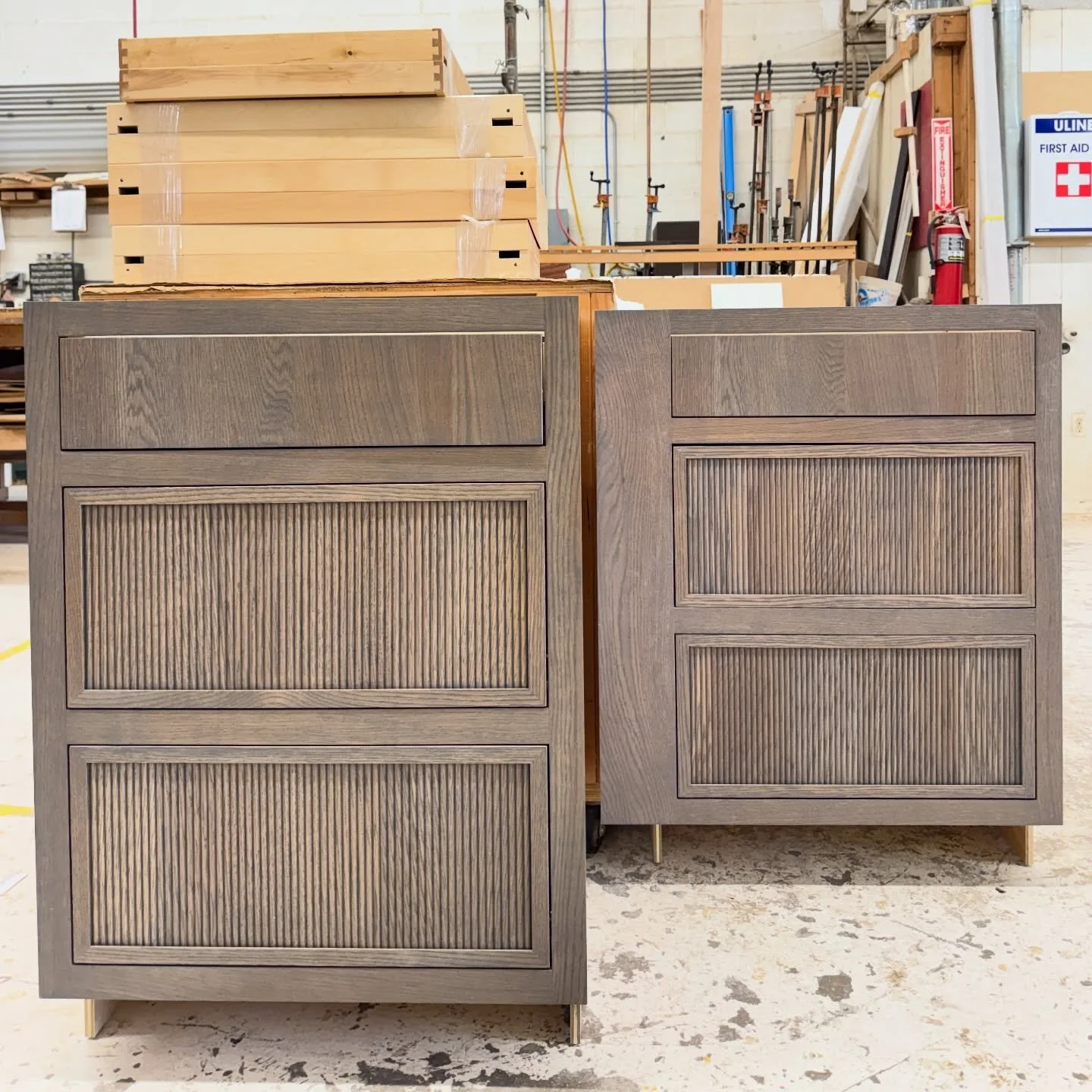 Slim shaker. reeded. Solid panels. White oak stained. Framed Inset. 

It was only a few base cabinets, but those 7/8&rdquo; thick solid panels reeded gave our design and engineering teams a real run for their money! Getting that cohesive look in an i