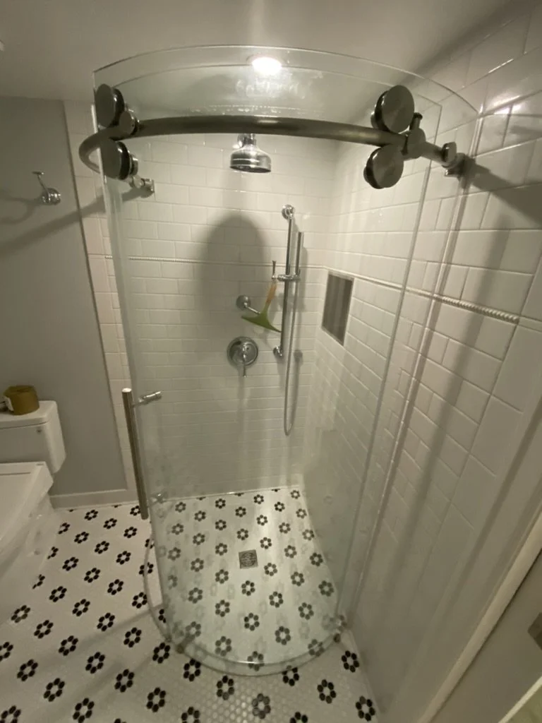 Basement Bathroom install with Curved glass shower