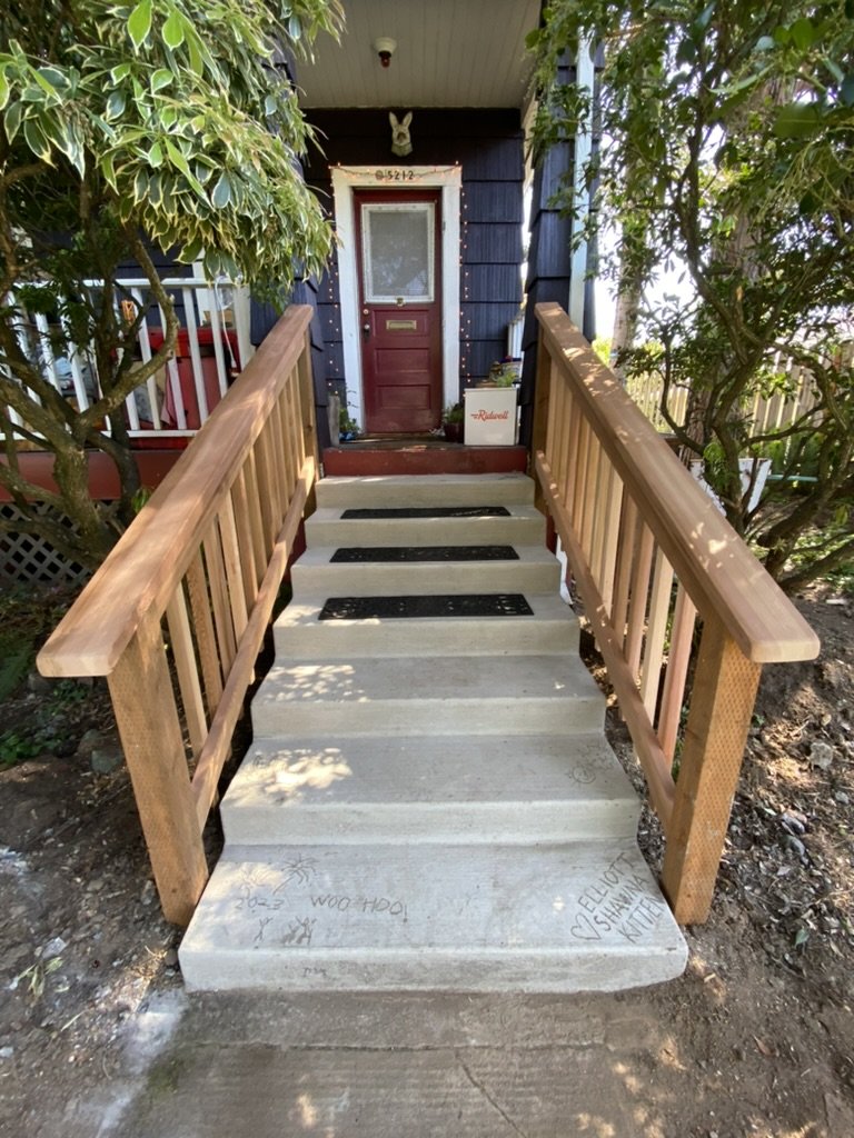 New concrete stairs and clear cedar railing