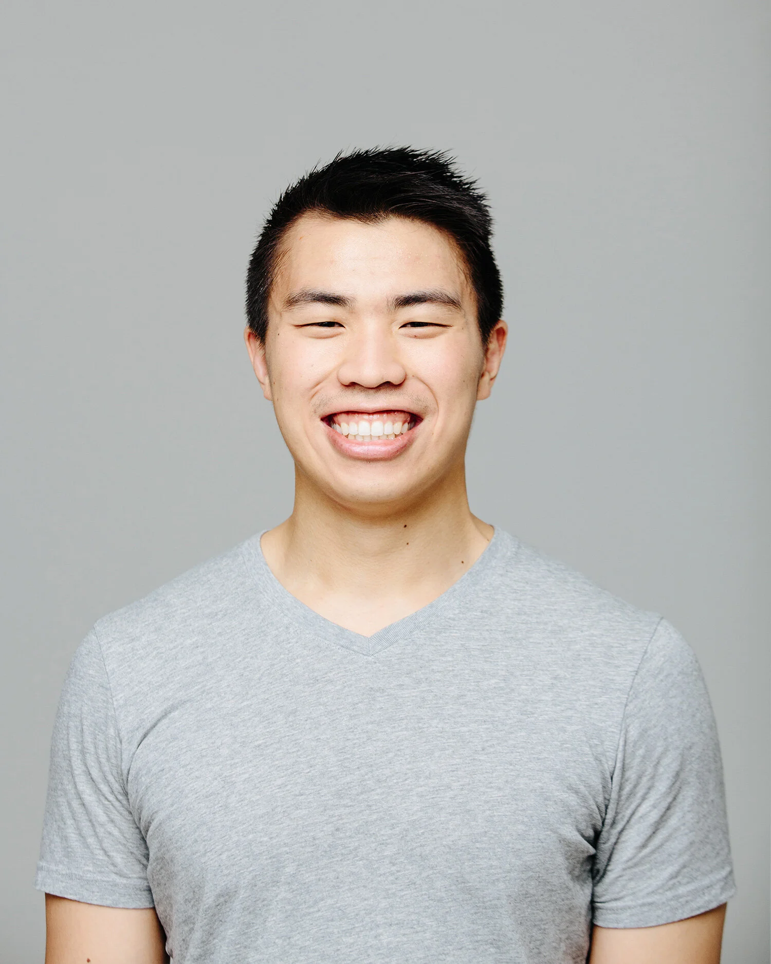 headshot of a smiling man